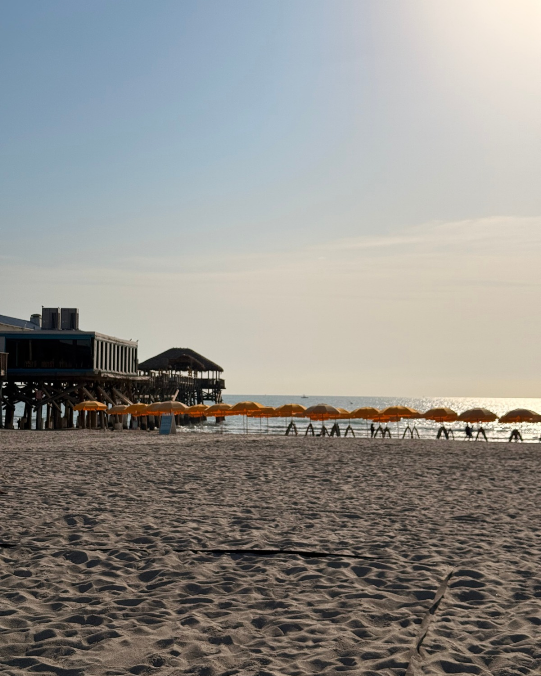 cocoa beach pier and beach chair and umbrella rentals.png