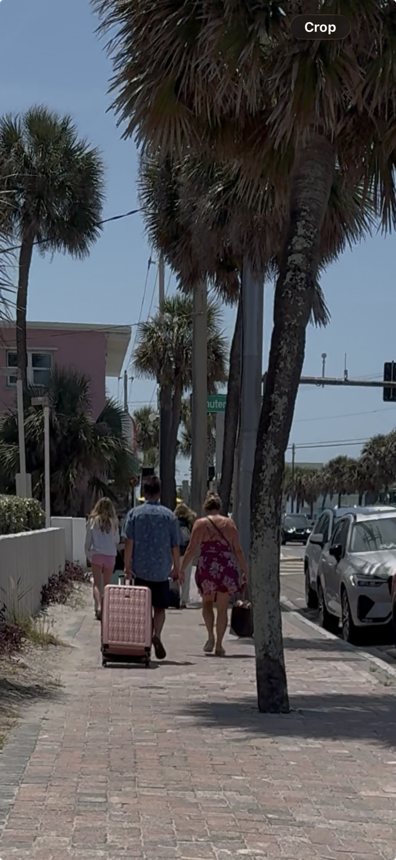 walking with luggage downtown cocoa beach.png
