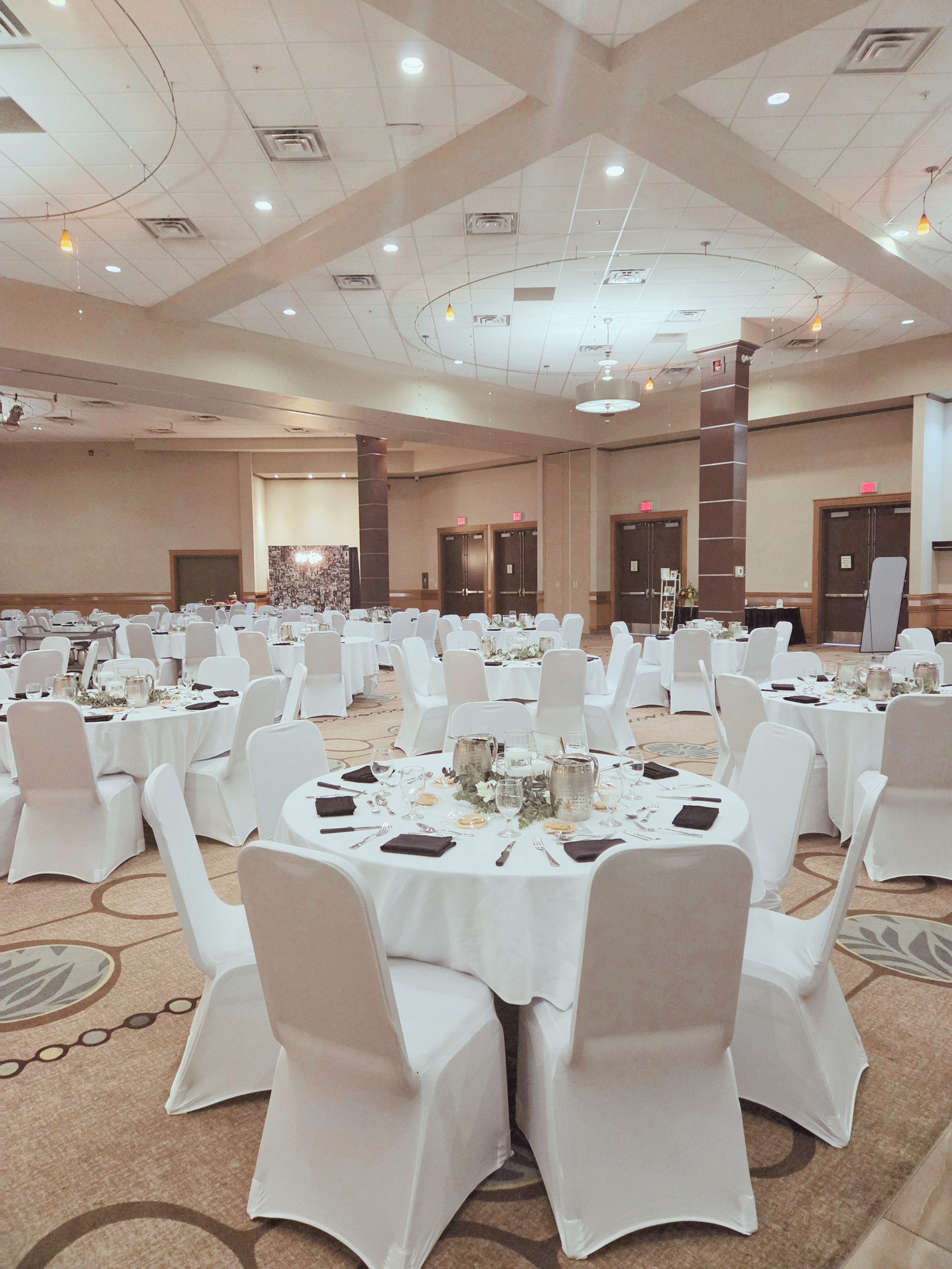Reception room setup for wedding celebration at Denham Hospitality