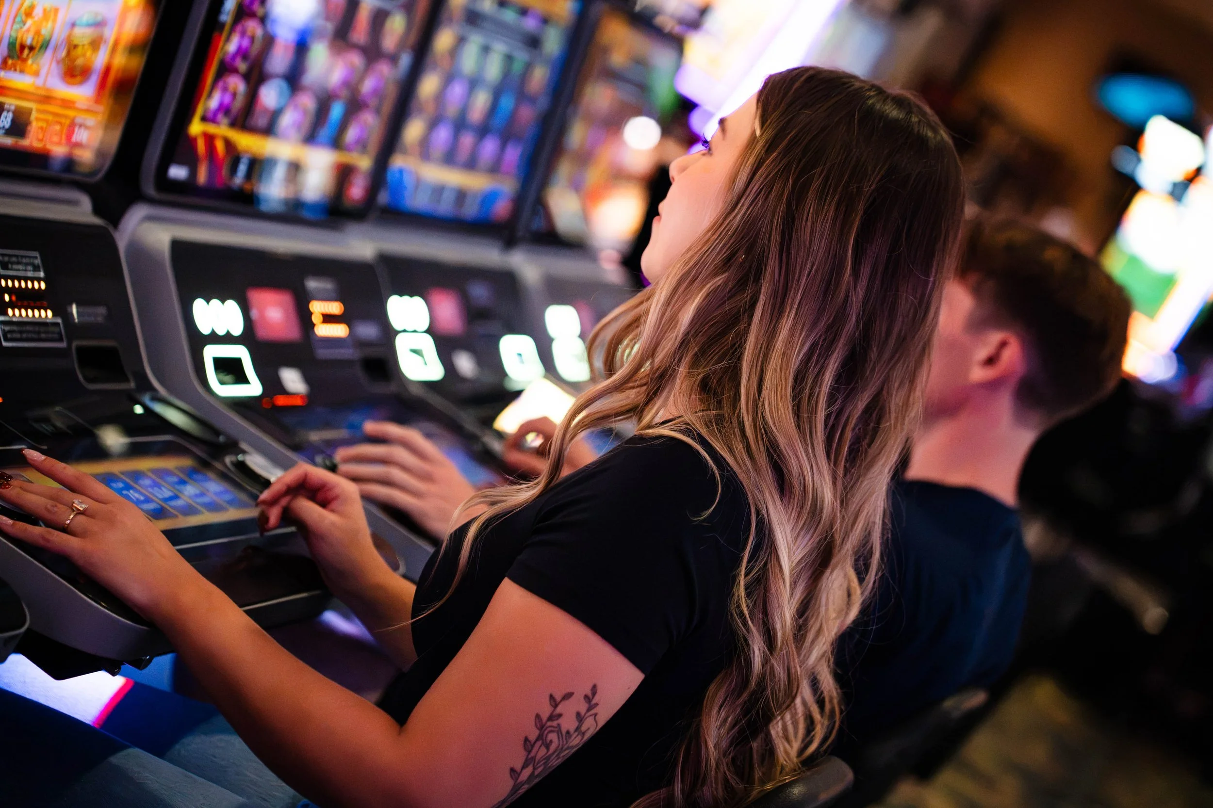 Women playing slot games at the Best Western Plus Rose Country Hotel