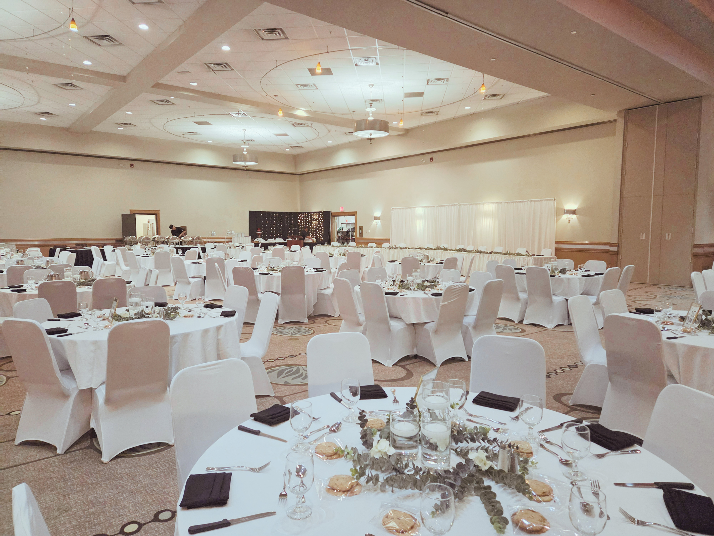 Regal Ballroom set up with white linens and tables for wedding