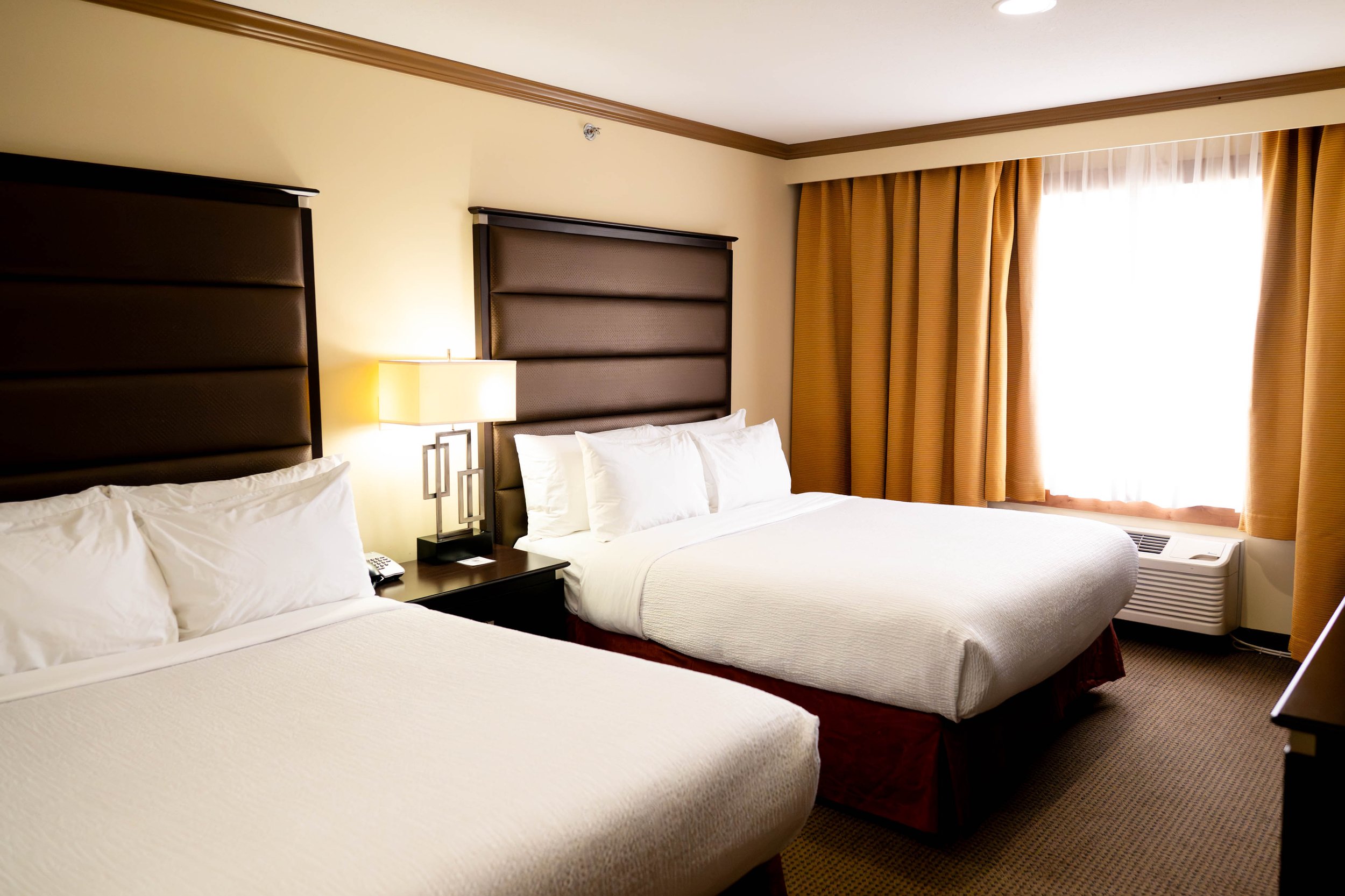 two queen beds in a hotel room at the Best Western Plus Rose Country Hotel