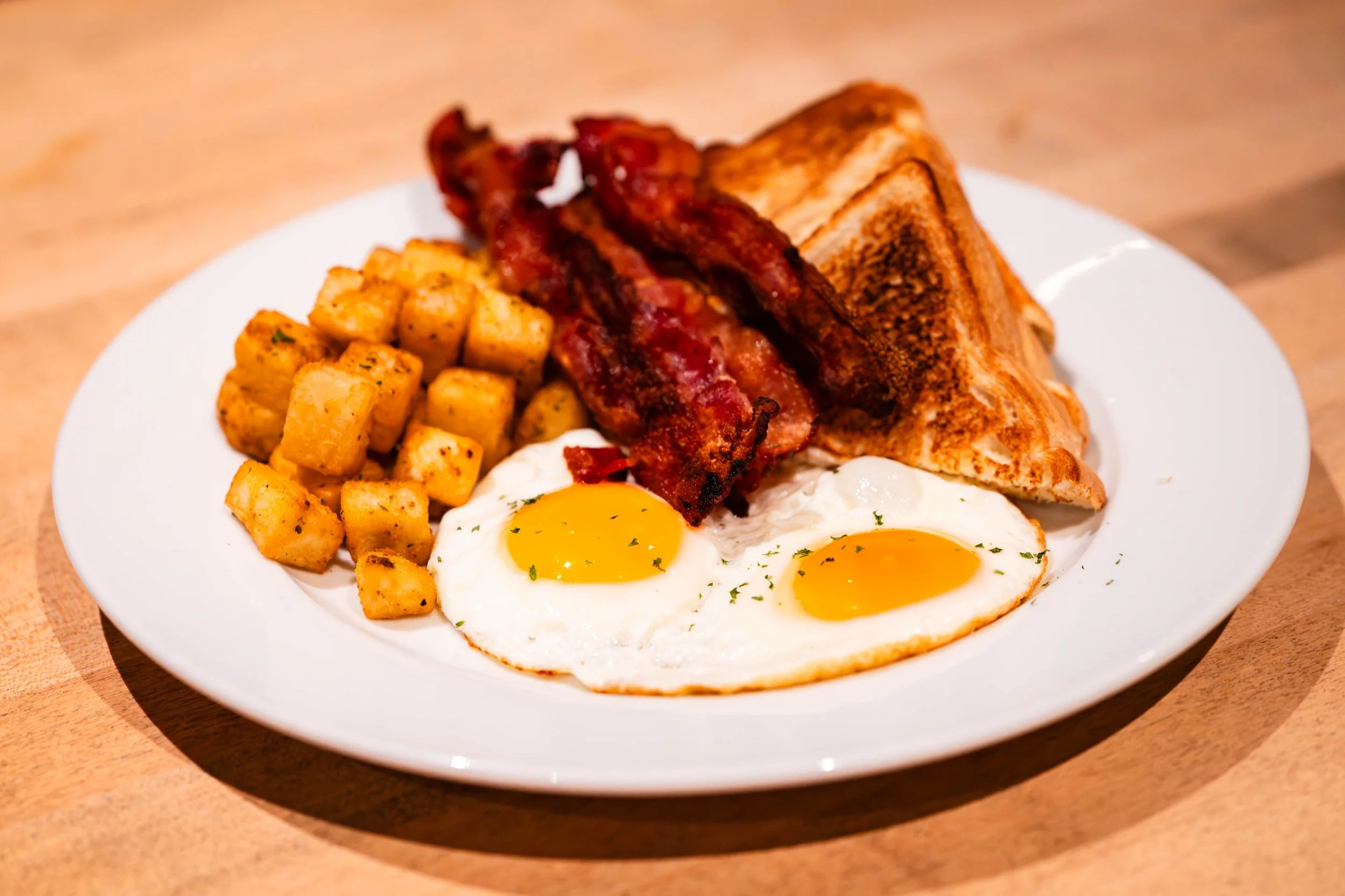 bacon and eggs with toast breakfast meal