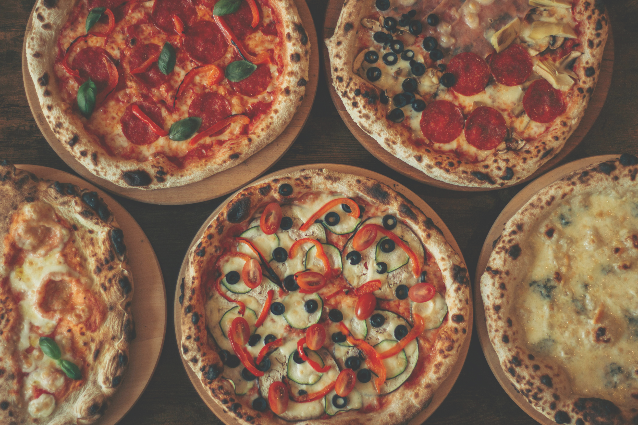 pizza party with freshly baked thick-crust Sicilian pizzas with gluten free options