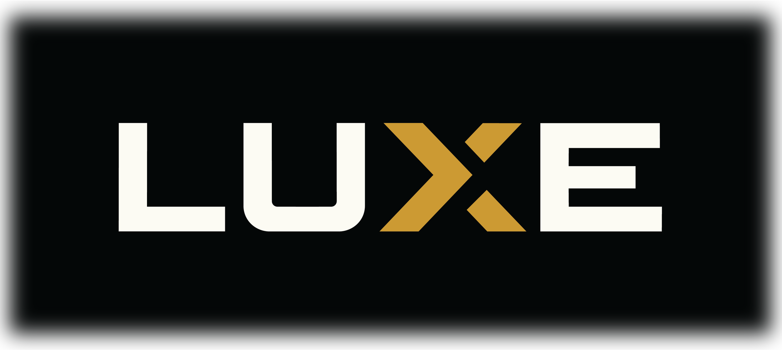 Luxe logo with white and gold text on a black background