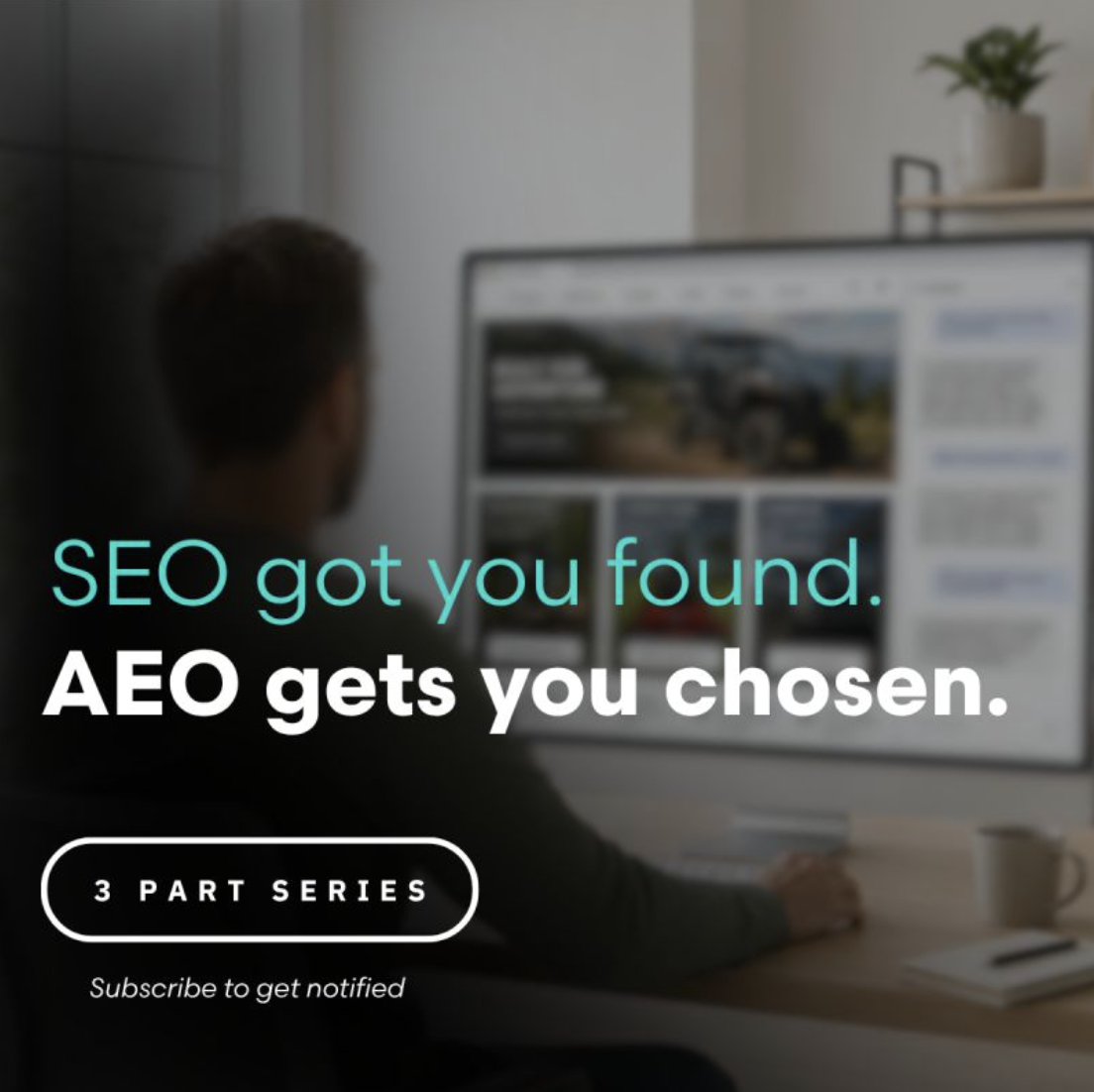 A person sitting at a desk in front of a computer monitor, with a potted plant on a shelf beside the monitor. The screen displays a website about vehicles. Text overlay reads "SEO got you found. AEO gets you chosen." and mentions a 3-part series with a prompt to subscribe for notifications.