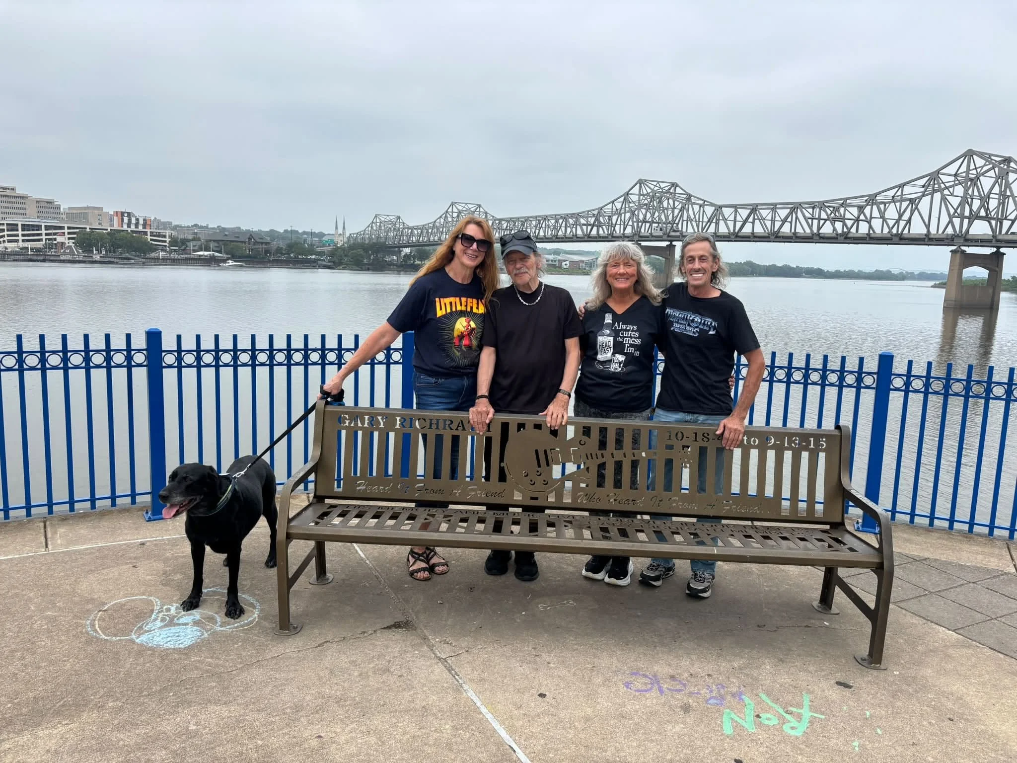 The memorial bench for original guitarist and songwriter to REO Speedwagon - Gary Richrath.  Pictured L-R is Becky's Dog, Becky Glass, Terry Luttrell, Reggie Stutzman, Greg Shute 