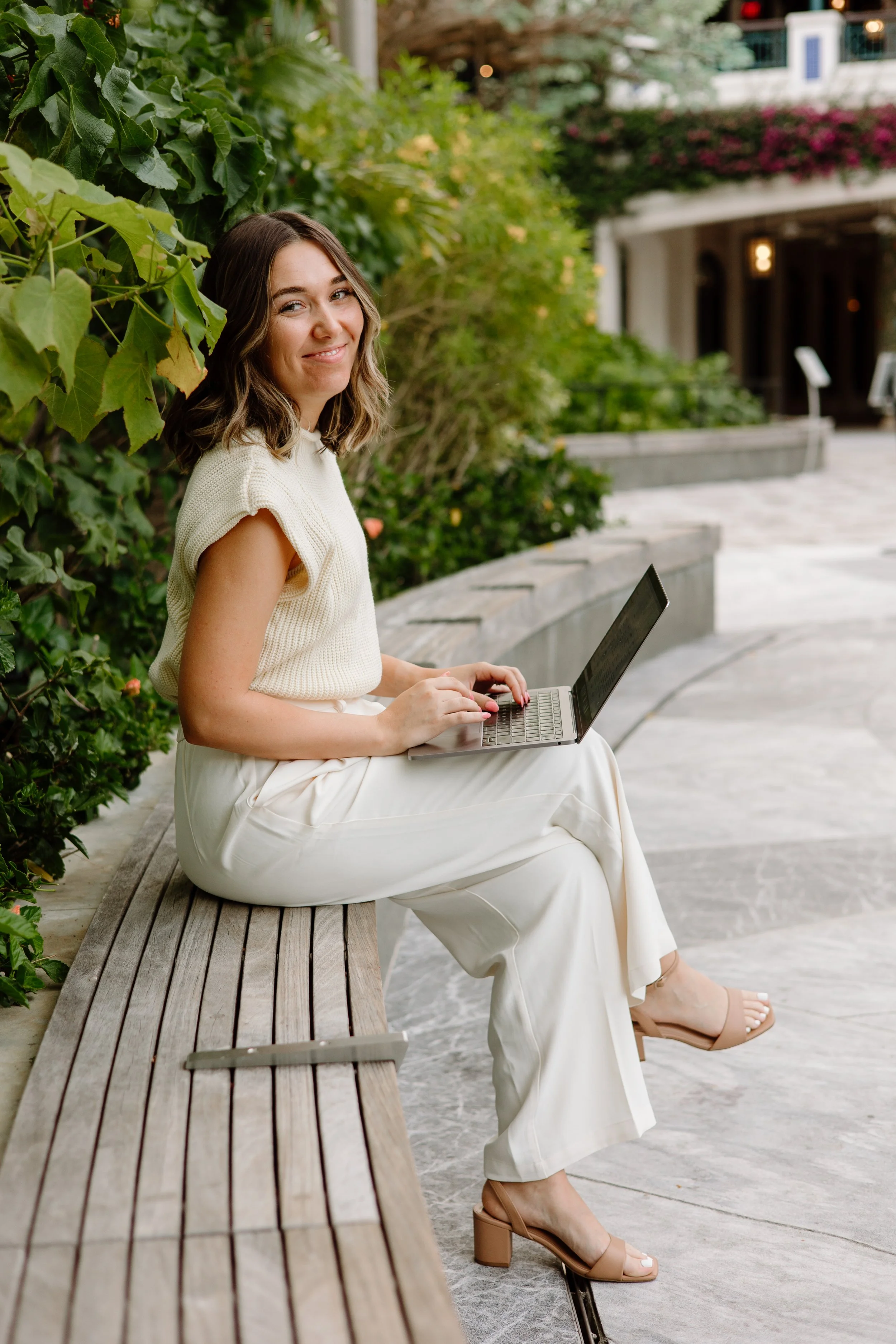 Kailyn España working outdoors on her laptop