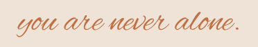 Inspirational quote in cursive: 'you are never alone.'