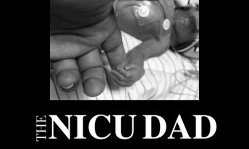 Black and white photo of a newborn baby's hand holding an adult's finger, with text below reading 'The NICU Dad'.