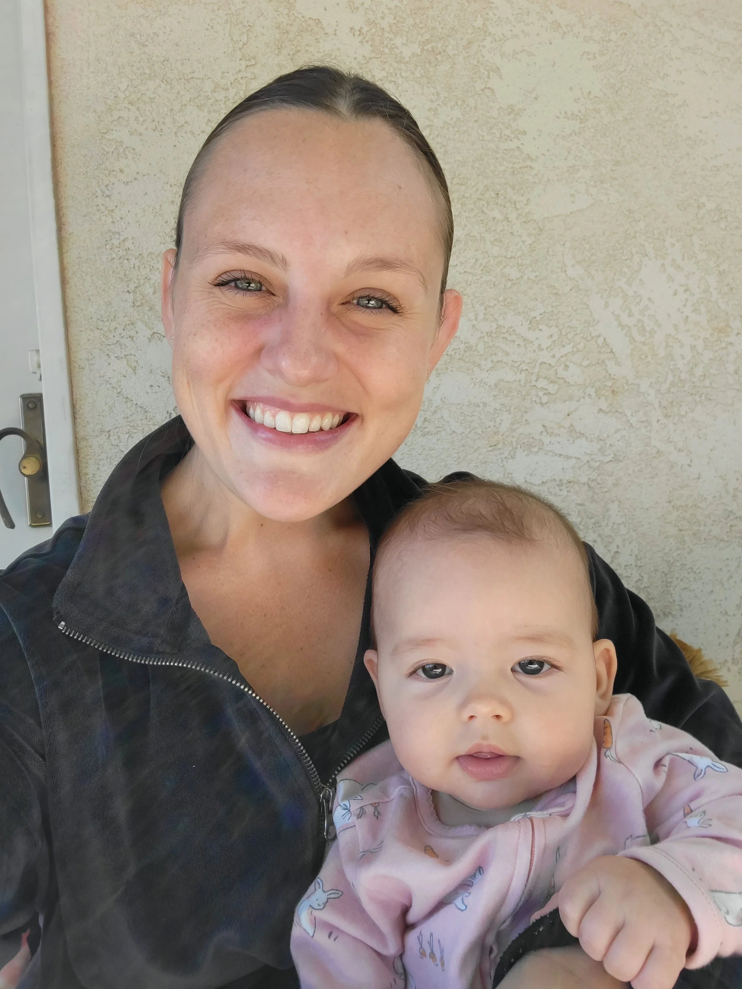 Orlene Originals artist with her child.