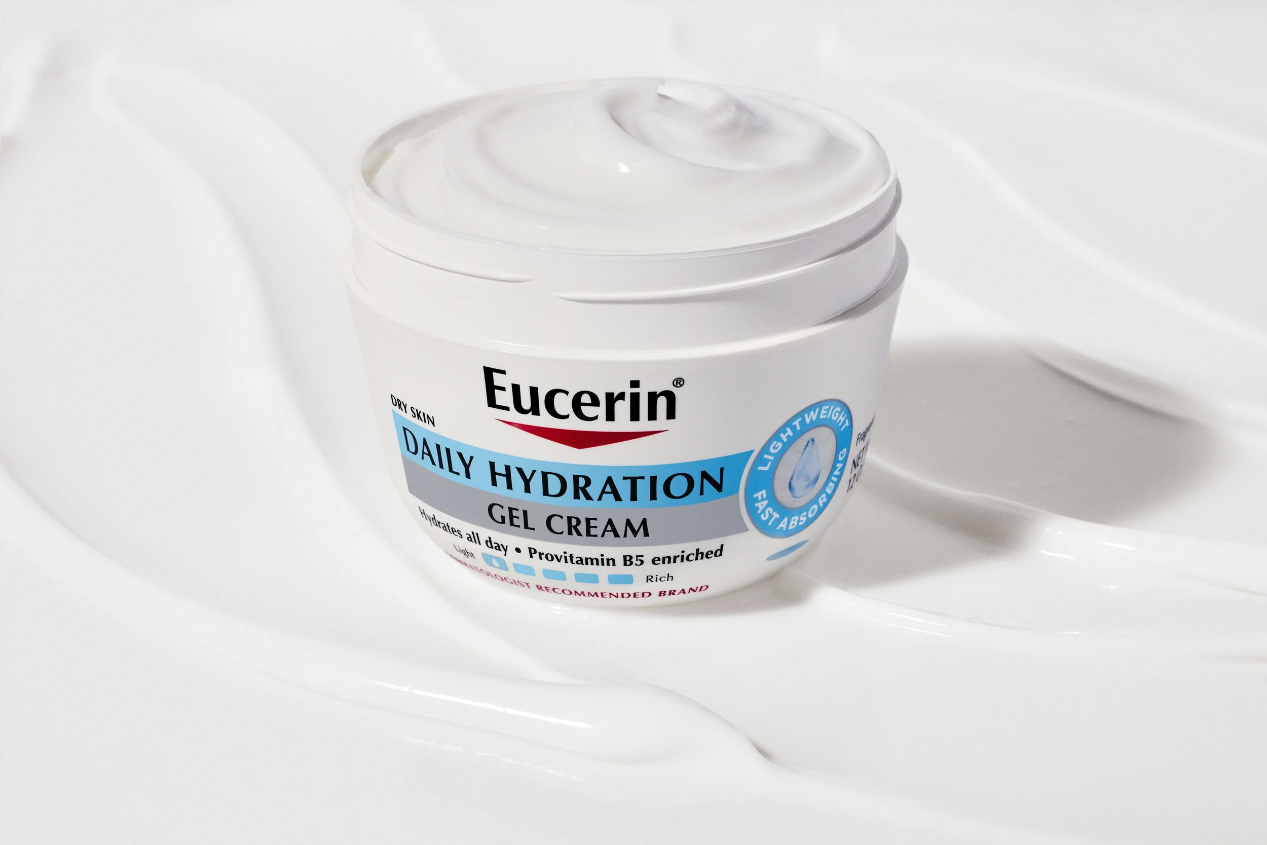 A white jar of Eucerin Daily Hydration Gel Cream placed on a white surface with a plain white background.