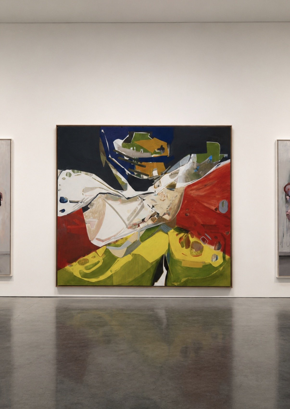 Very large abstract colorful painting in a gallery with white walls and gray flooring.