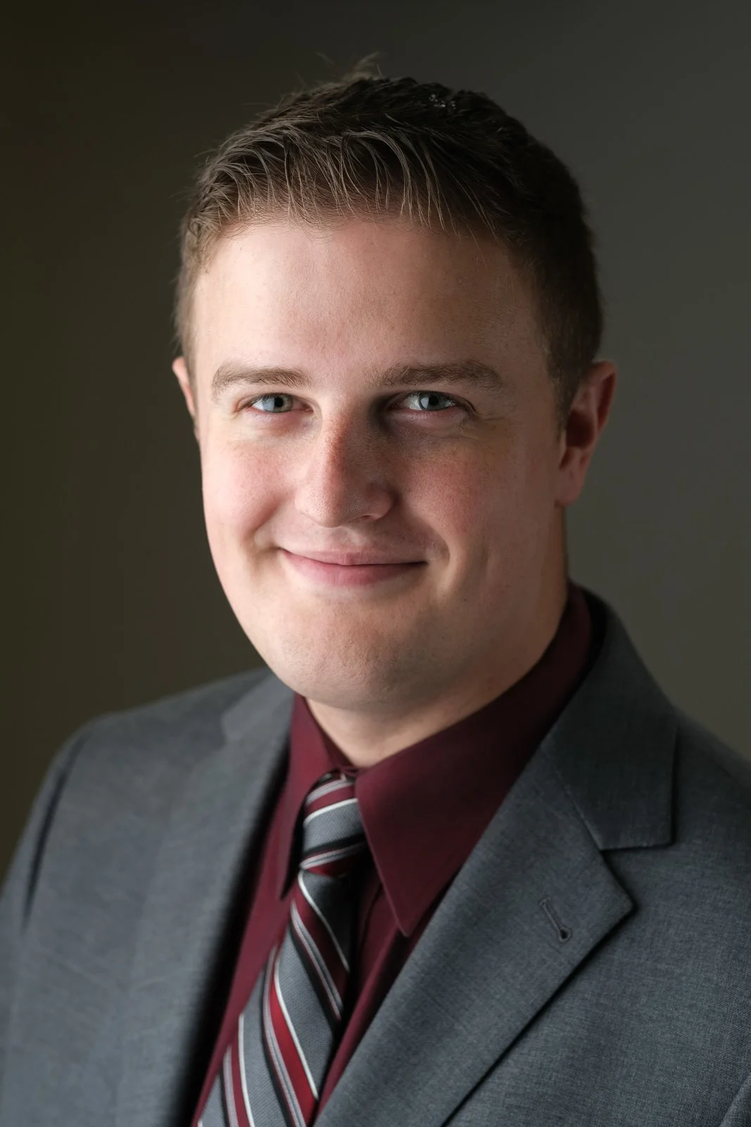 studio headshot of James Krawecki in suit and tie
