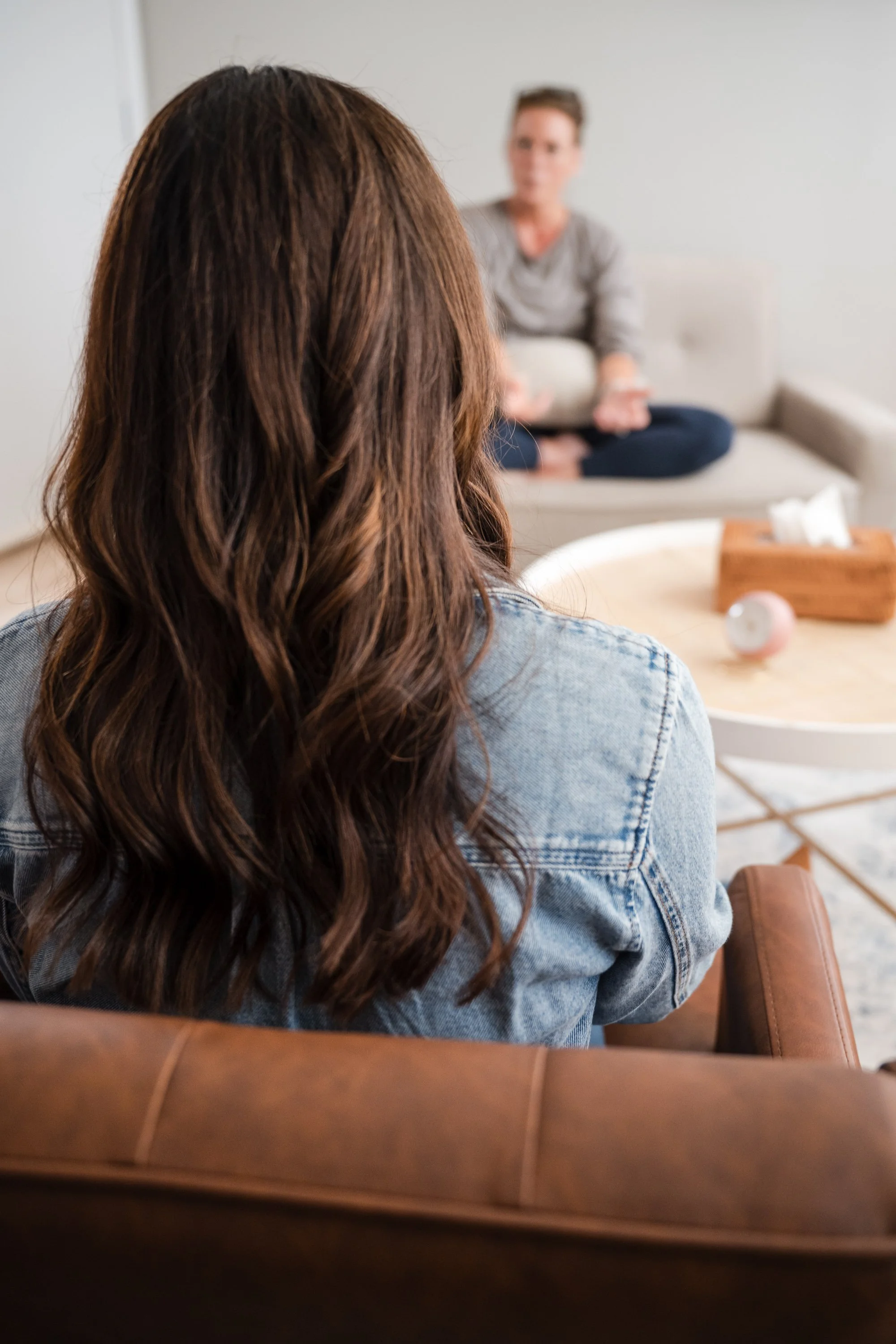 Looking over the shoulder of the Verdure therapist during a session with a client in the therapy room