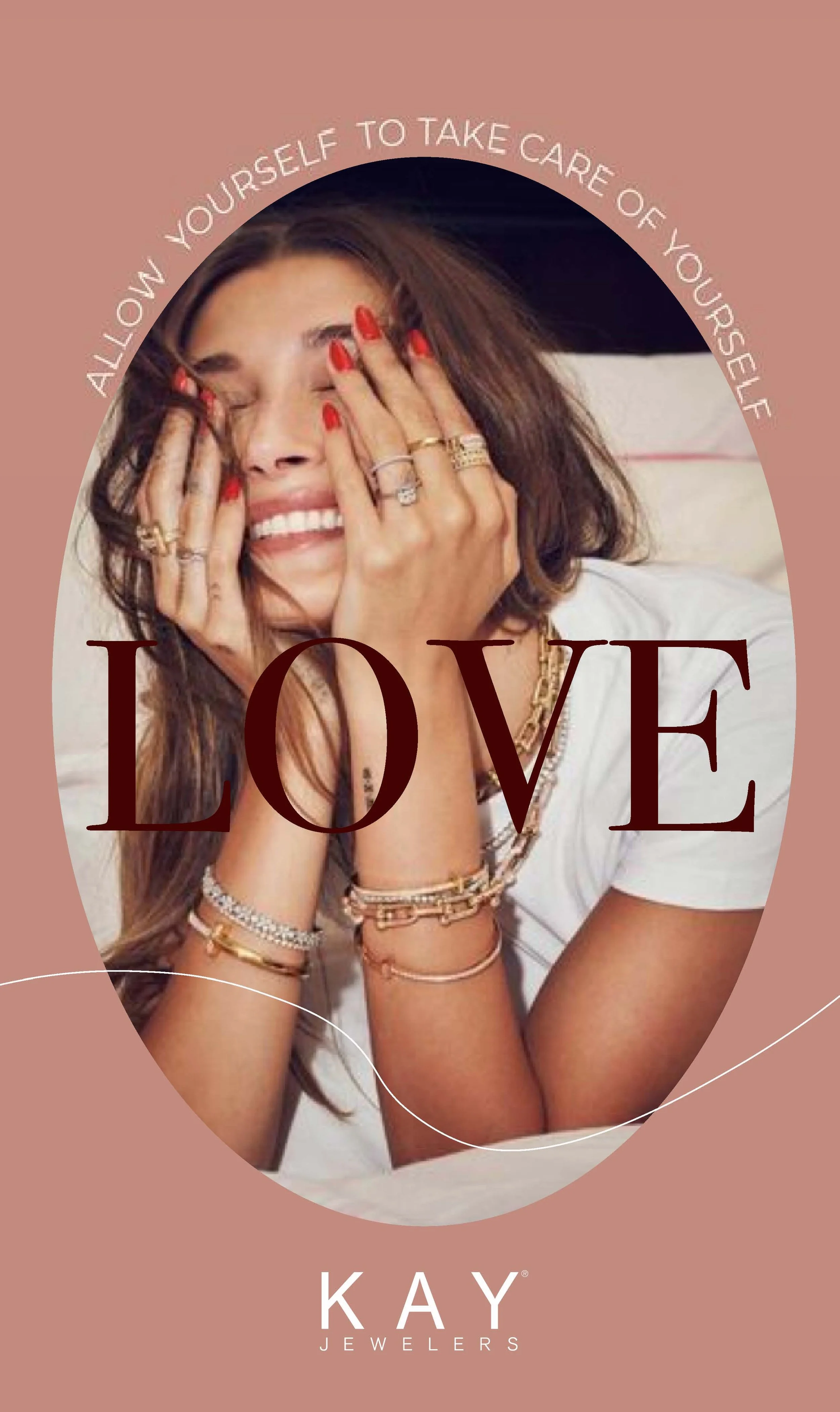 A woman with brown hair and multiple rings, bracelets, and necklaces smiling with her eyes closed, covering her face with her hands. The image has a pink background with the text 'ALL ON YOURSELF TO TAKE CARE OF YOURSELF' in a circular pattern around the woman, and the word 'LOVE' in large letters below her face. The brand name 'KAY JEWELERS' is at the bottom.