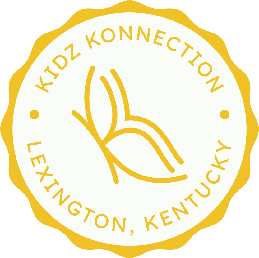 A circular logo with a gold scalloped border. Inside, it features a simplified line drawing of a leaf in gold. Surrounding the leaf are the words 'KIDZ KONNECTION' at the top and 'LEXINGTON, KENTUCKY' at the bottom, both in gold uppercase letters.