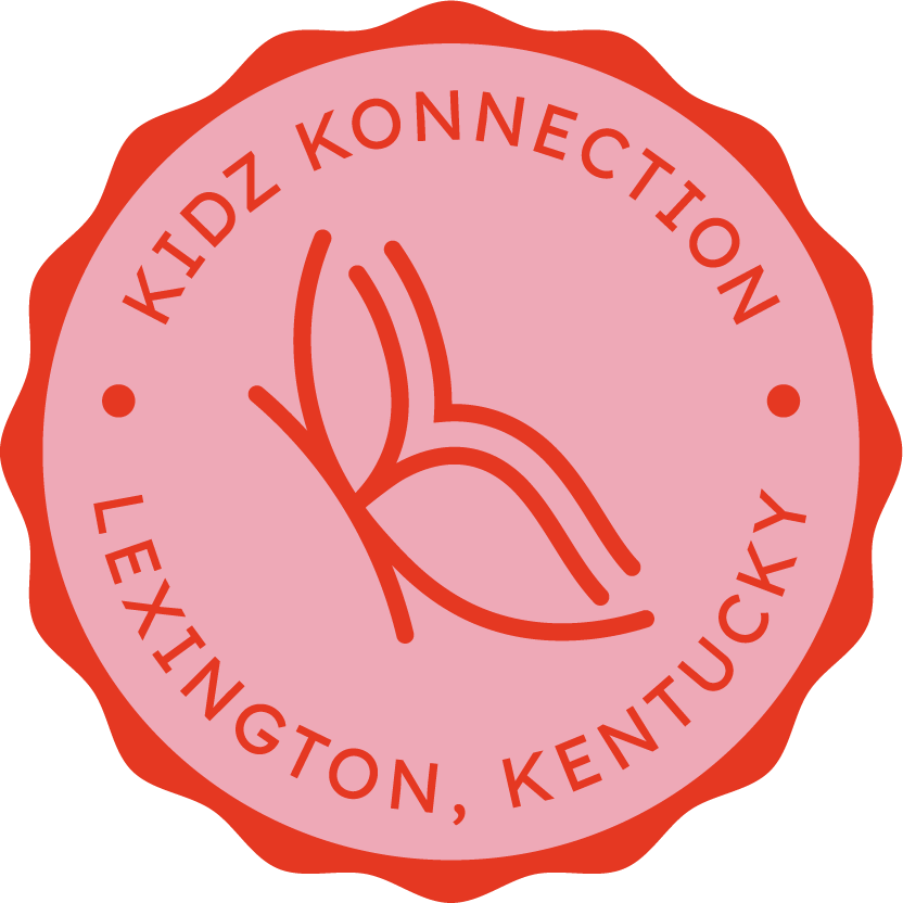 A circular logo with a pink background and red border. Inside, there is a red line drawing of a butterfly and text that reads 'KIDZ KONNECTION' at the top and 'LEXINGTON, KENTUCKY' at the bottom.