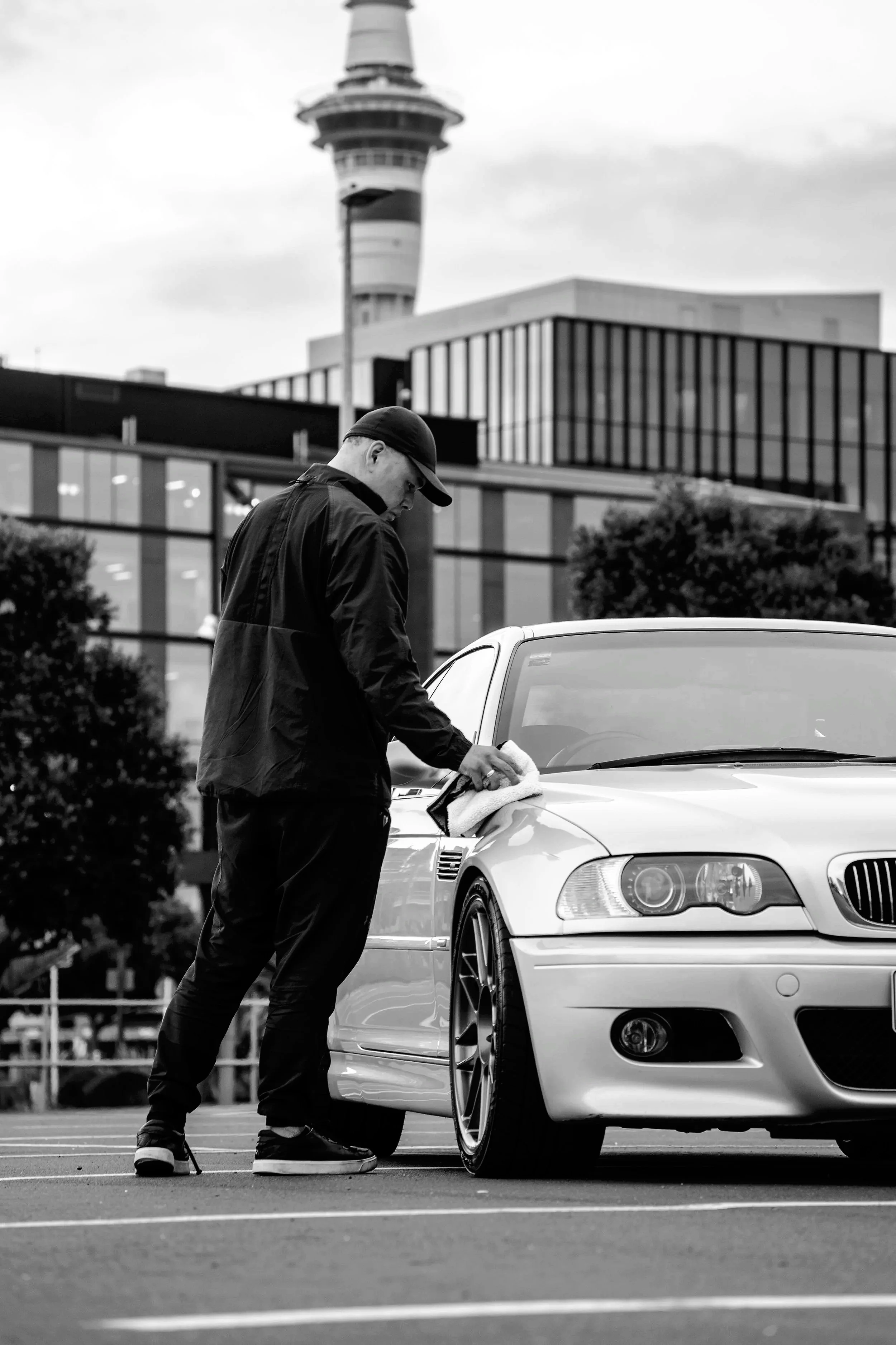 detailer assessing the car after a detail