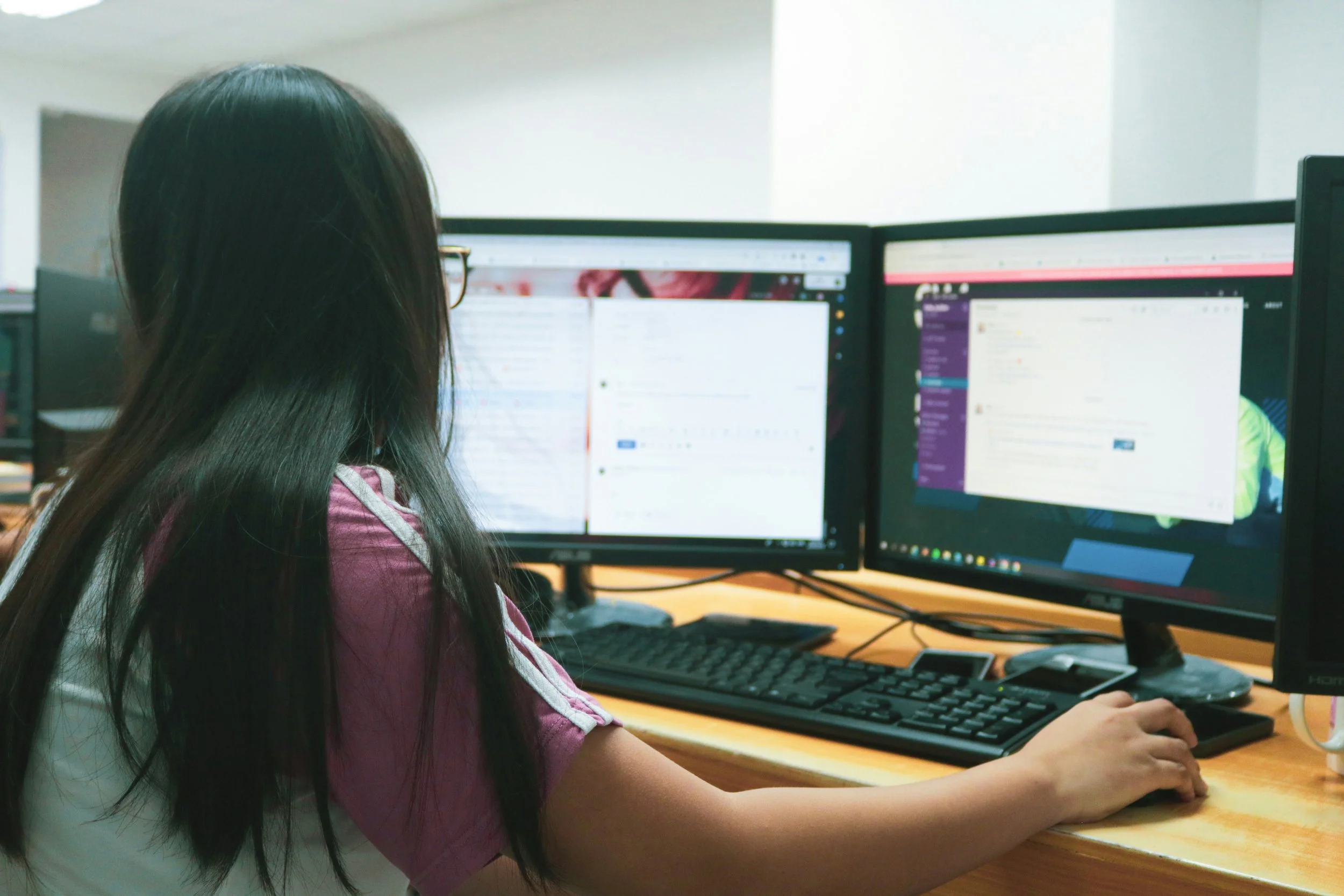 photo of girl working on computers by Patrick Amoy from unsplash.com