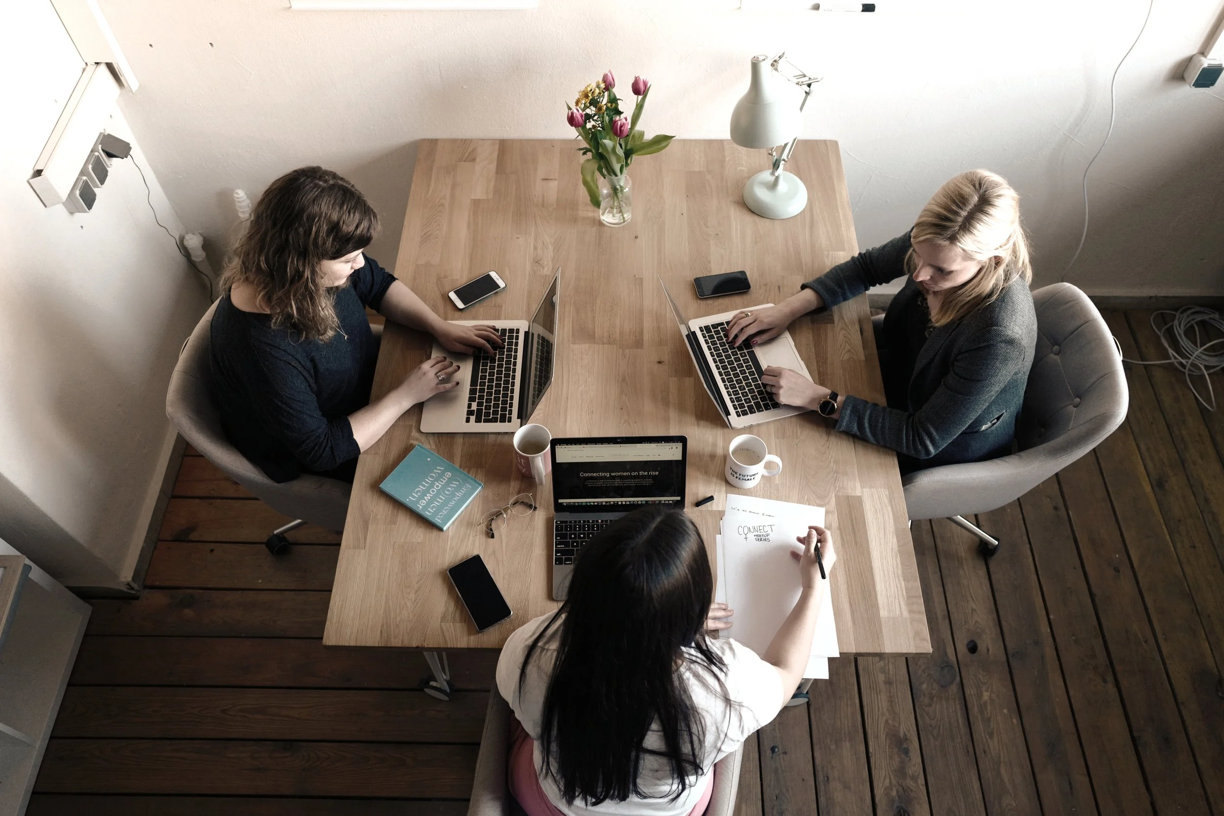 Women sitting at a table working together