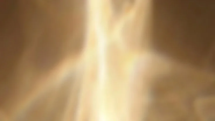 A blurry, abstract image with gold and brown tones.