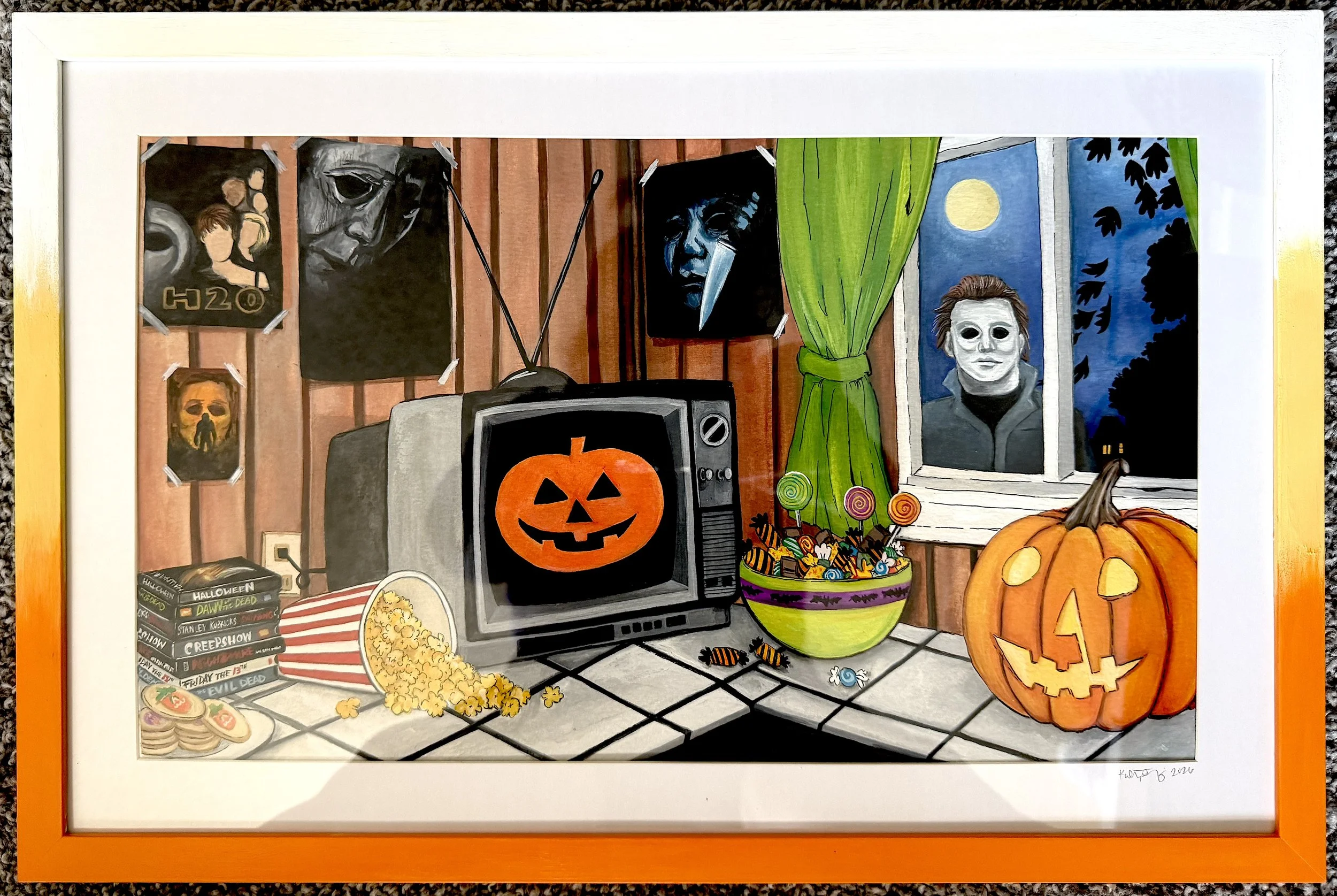 A framed painting of a Halloween-themed scene on a wall, featuring a pumpkin with a carved face, a bowl of candy, a vintage TV with a pumpkin face on its screen, and various Halloween posters and decorations.