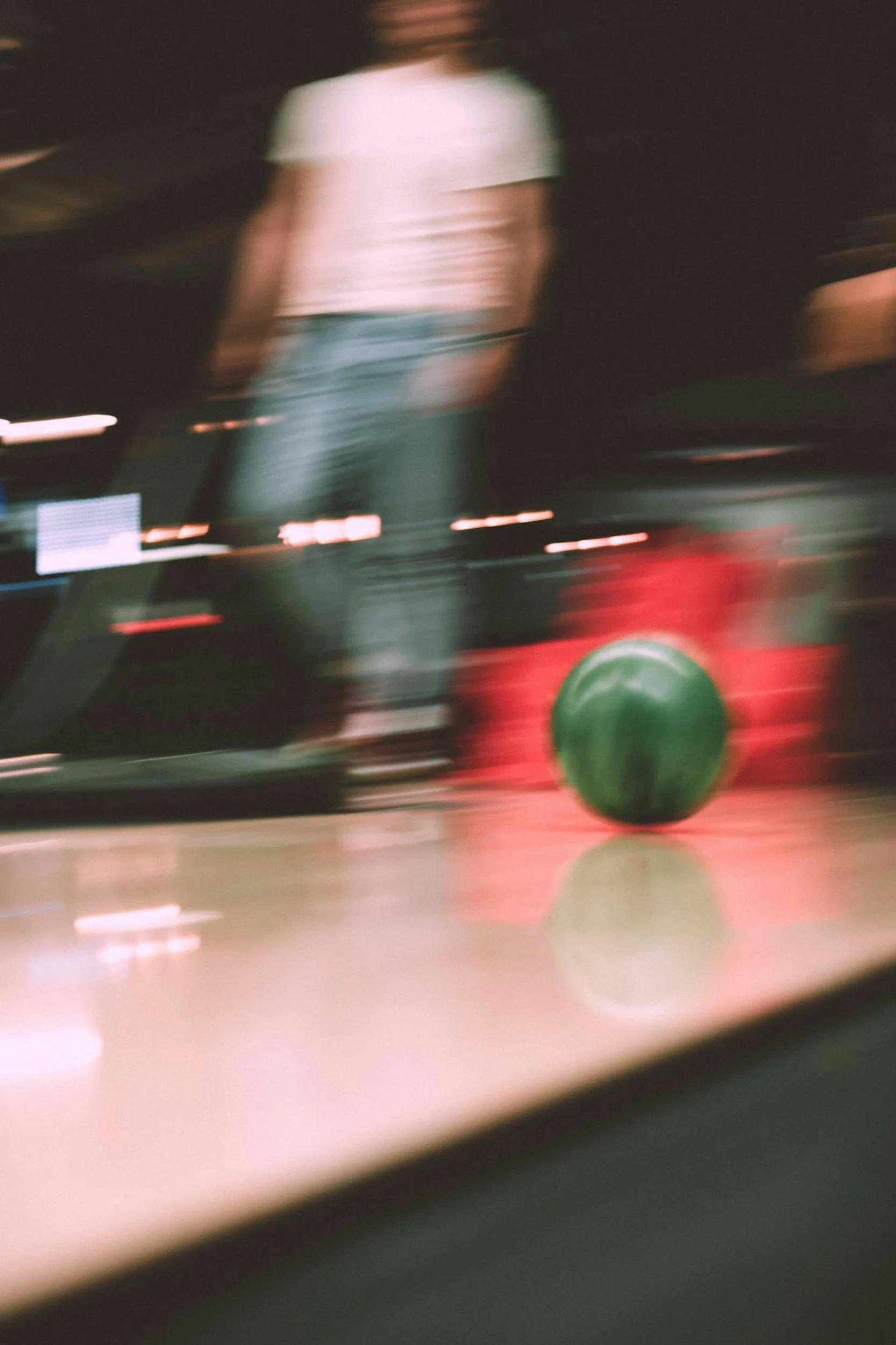 Photo of a bowling ball in motion.
