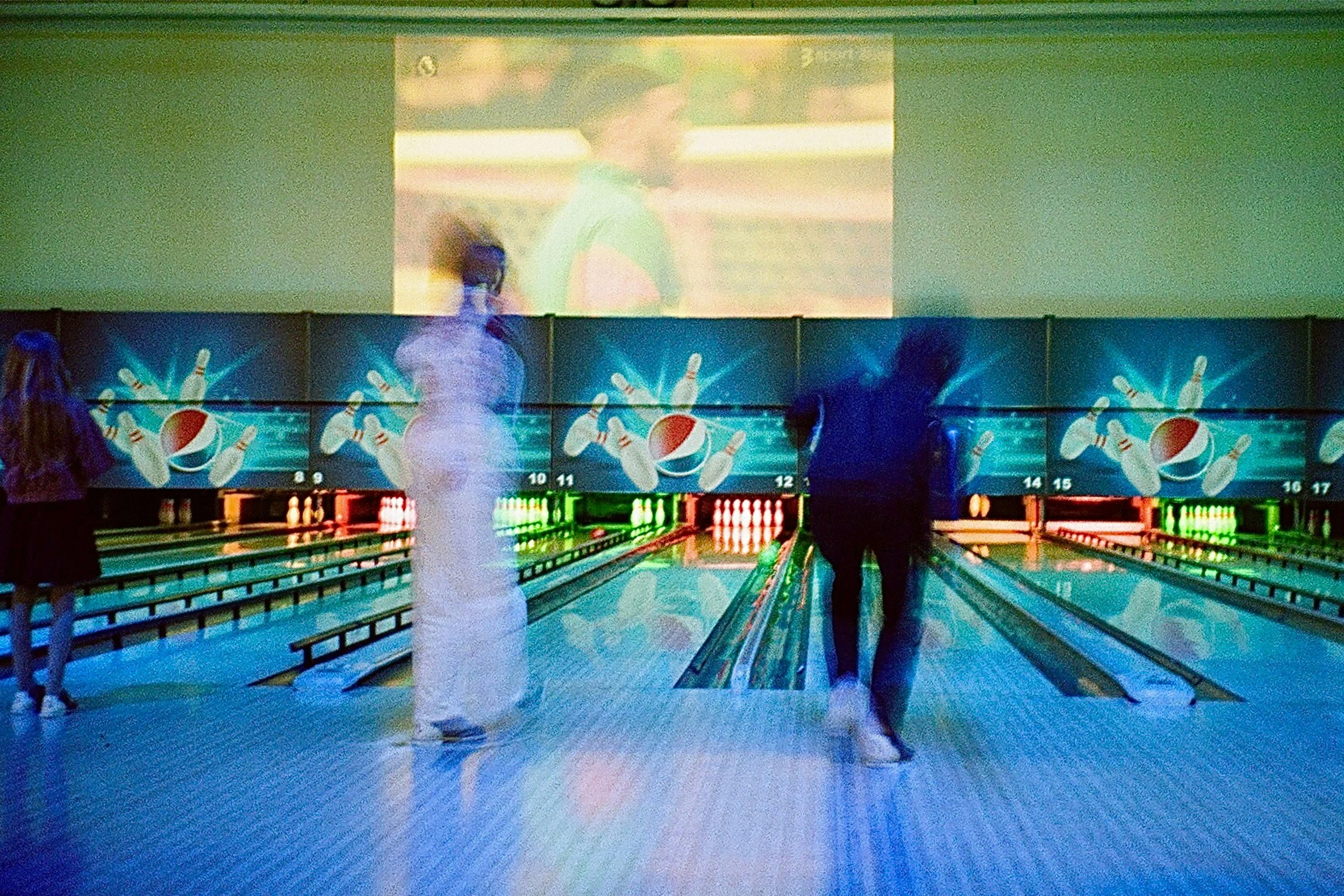 Photo of people bowling in motion
