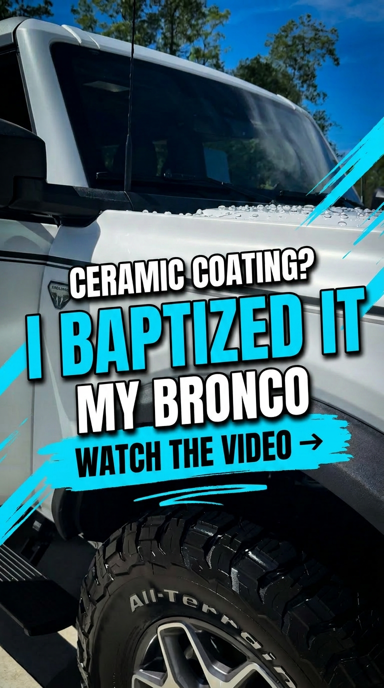 Close-up of a white pickup truck with a large tire and rugged tread, with text overlay promoting a video about ceramic coating on a Bronco.