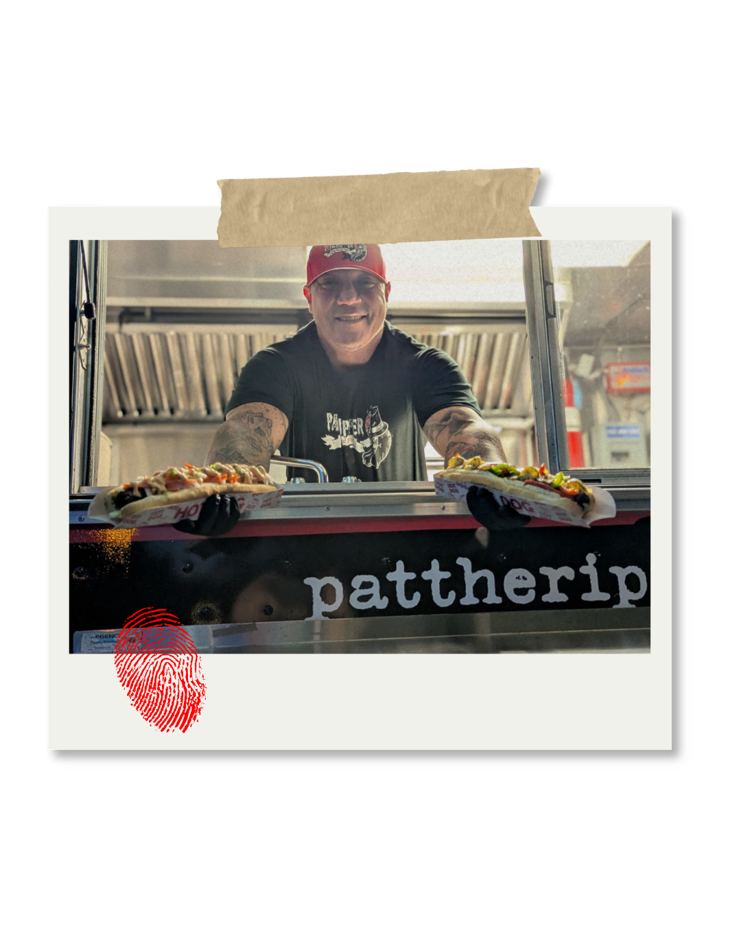 A smiling man in a black t-shirt and red cap serving pizza from a food truck with the word 'patherip' on it. There is a red fingerprint icon in the lower left corner of the photo.
