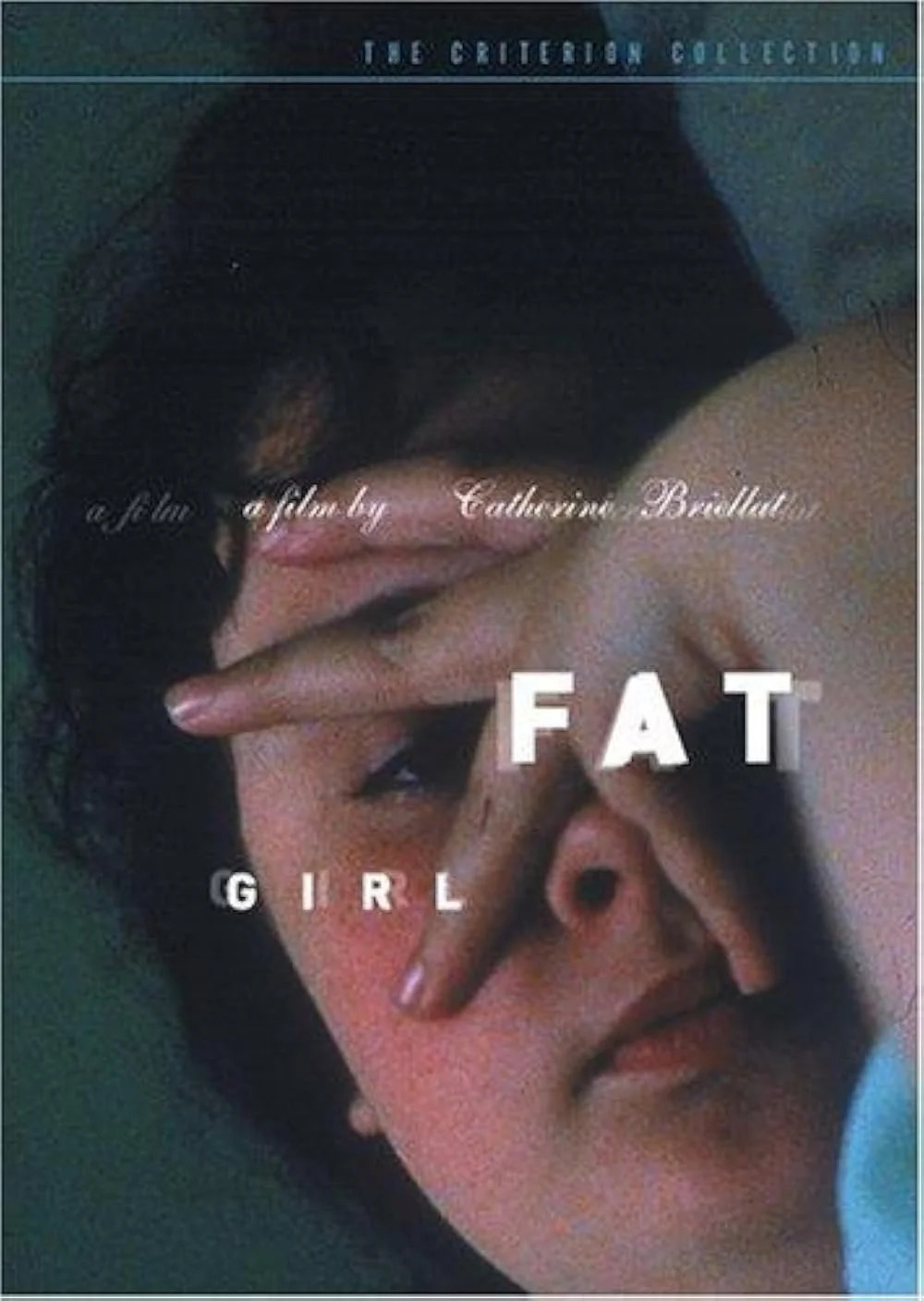 The cover of the film 'Fat Girl,' directed by Catherine Breillat, showing a woman with short dark hair making a gesture with her hand over her face.