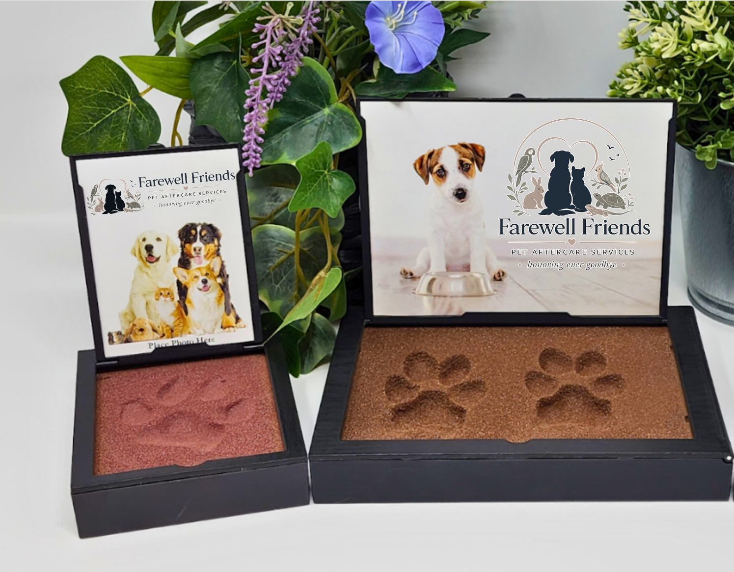 Memorial display for a pet, with a photo of a puppy, floral arrangement, and two makeup palettes with paw print imprints.