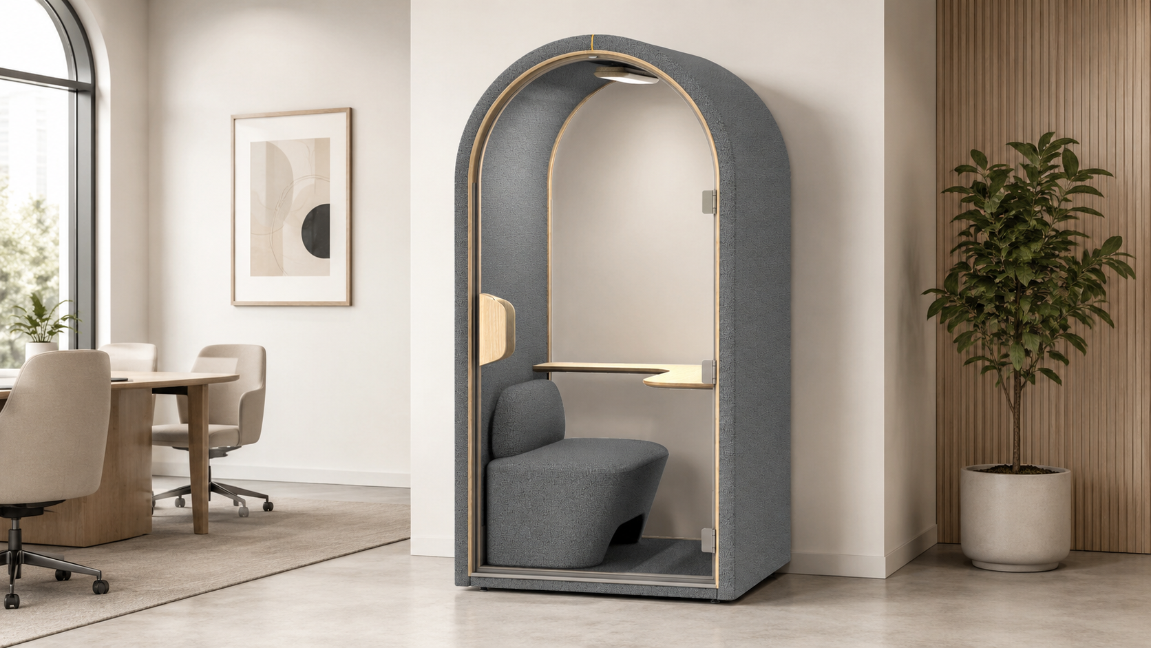 Interior of a GoPod soundproof office pod: grey acoustic panels, small desk and cushioned seat for focused work