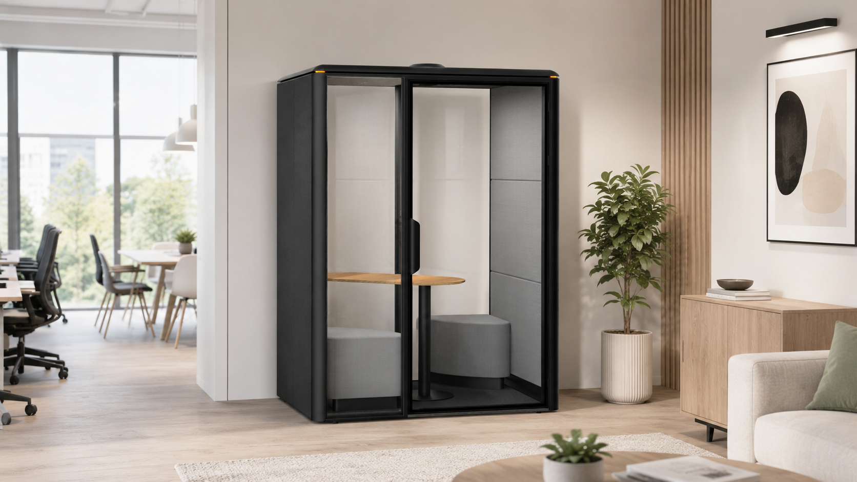 GoPod semi-private acoustic pod with desk and chairs in a contemporary office with plants and wall art