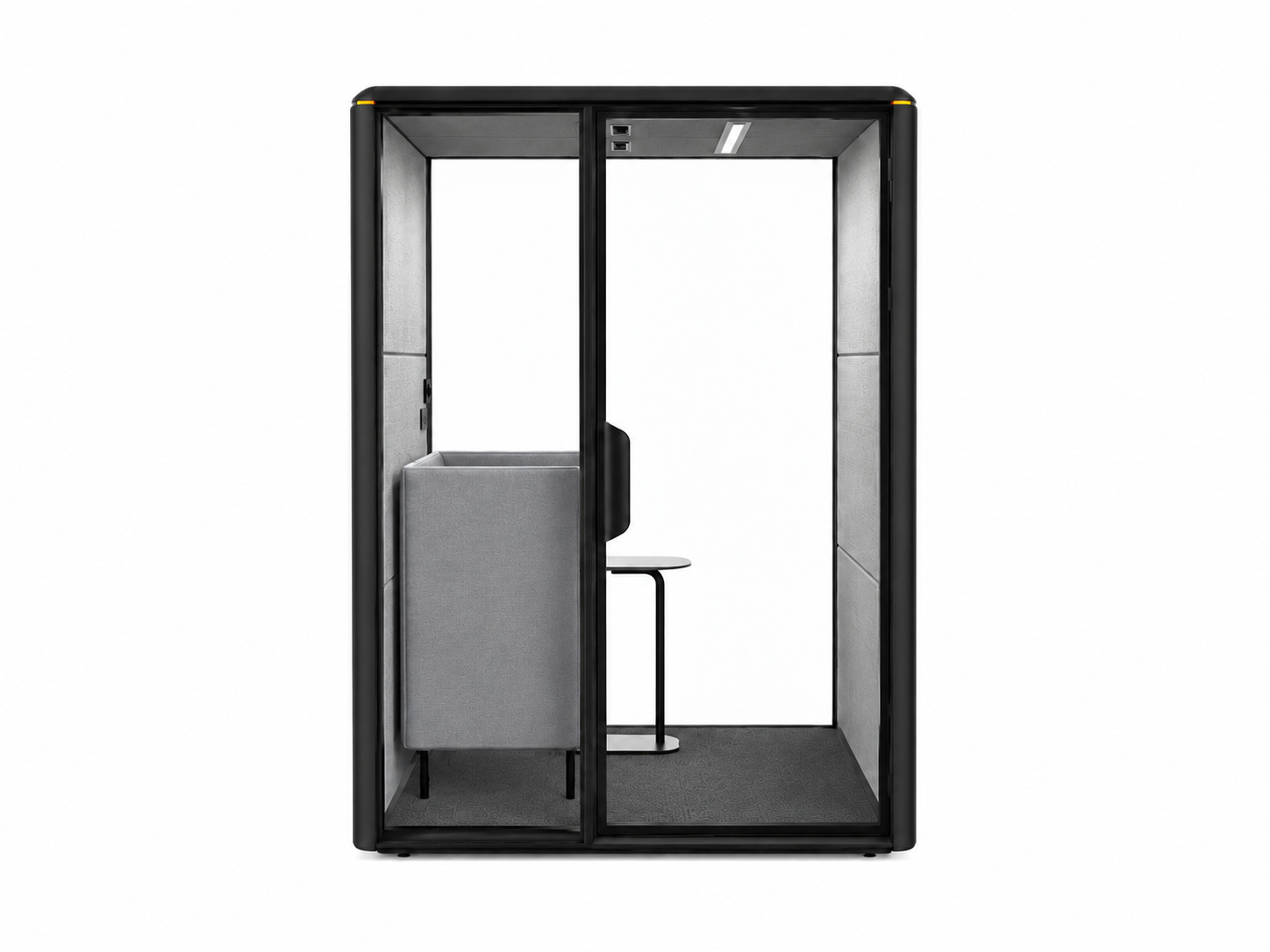Modern phone booth with black exterior, grey interior walls, small grey bench, and a small side table, set against a plain white background.