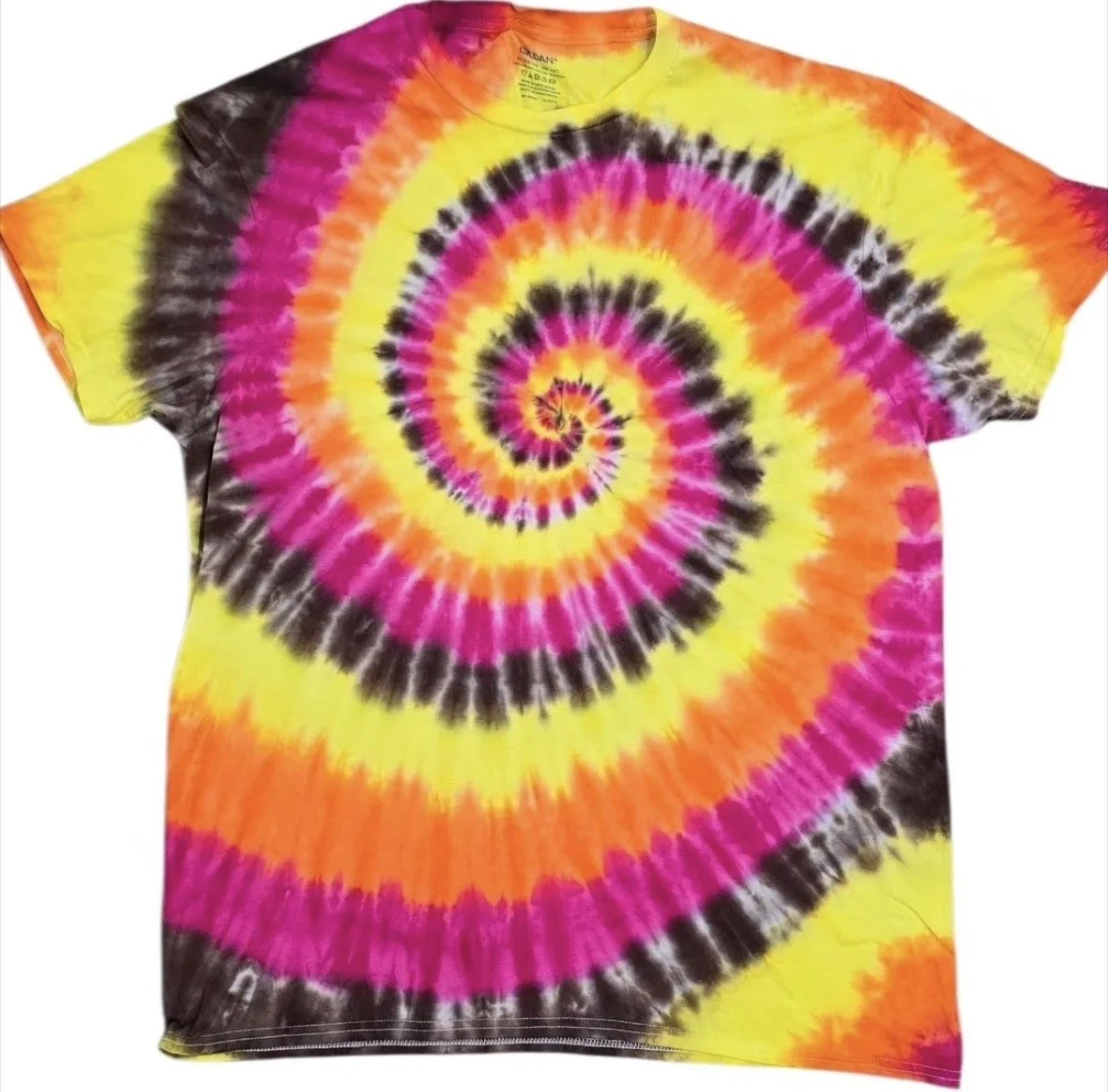 Colorful spiral tie-dye T-shirt with yellow, pink, orange, black, and purple patterns.