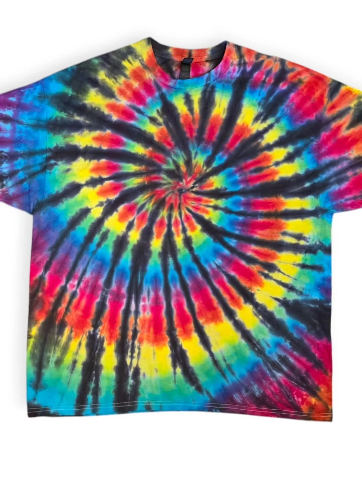 Tie-dye T-shirt with a spiral pattern in multiple bright colors including red, orange, yellow, green, blue, and black.