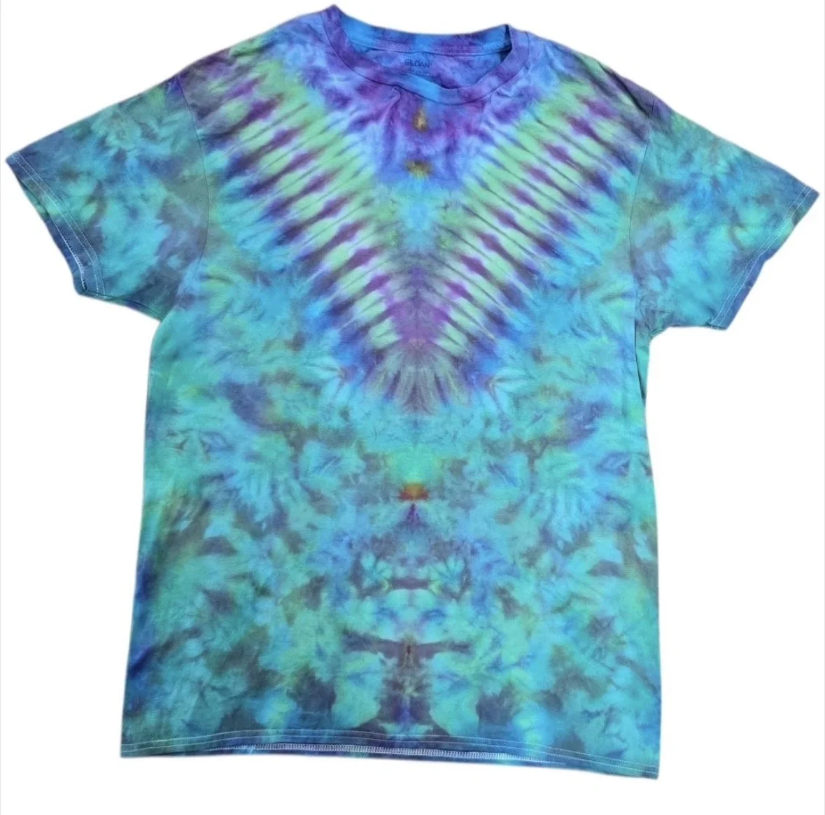Colorful tie-dye T-shirt with shades of blue, purple, green, and yellow, featuring a symmetrical, abstract pattern.