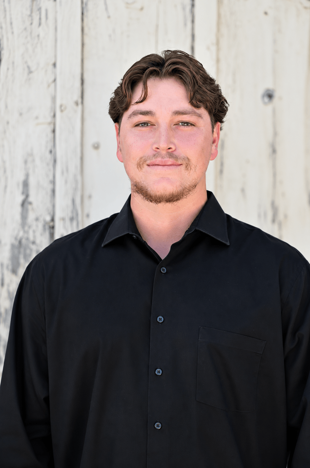 Josh Martinez, Project Manager at Quality Builders, dressed in all black.