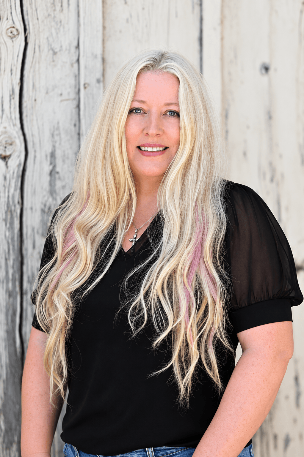 Celina Crouse, Interior Designer at Quality Builders, dressed in all black.