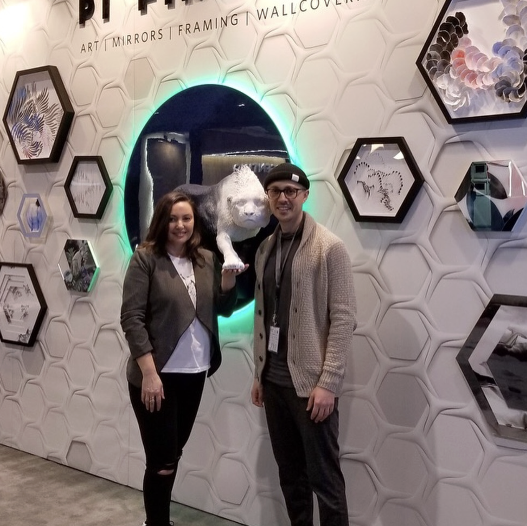 Team Photo: Photographed in PI's booth during the IDS (Interior Design Show) in Toronto. This installation featured one of the company's custom illuminated avant-garde concepts alongside several alternative wall décor products developed for commercia