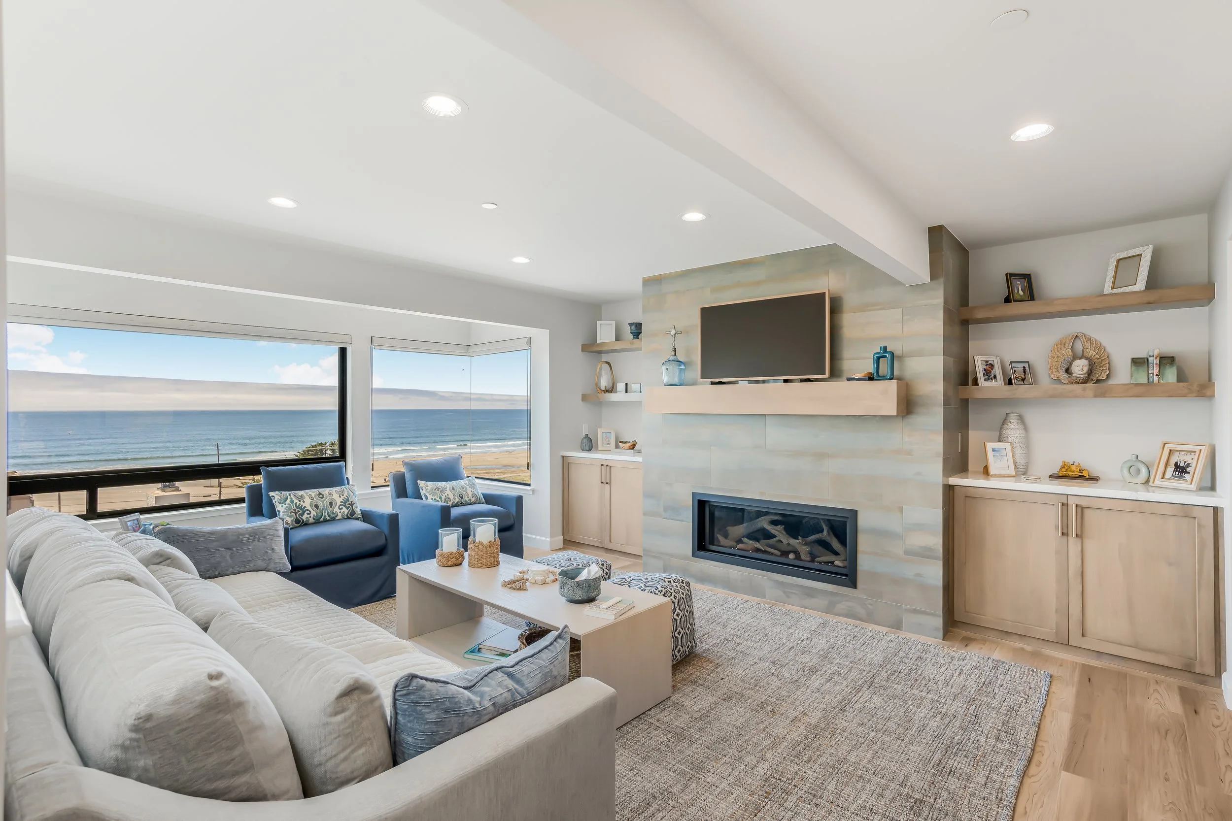 Photo of a fireplace in a living room with an ocean view