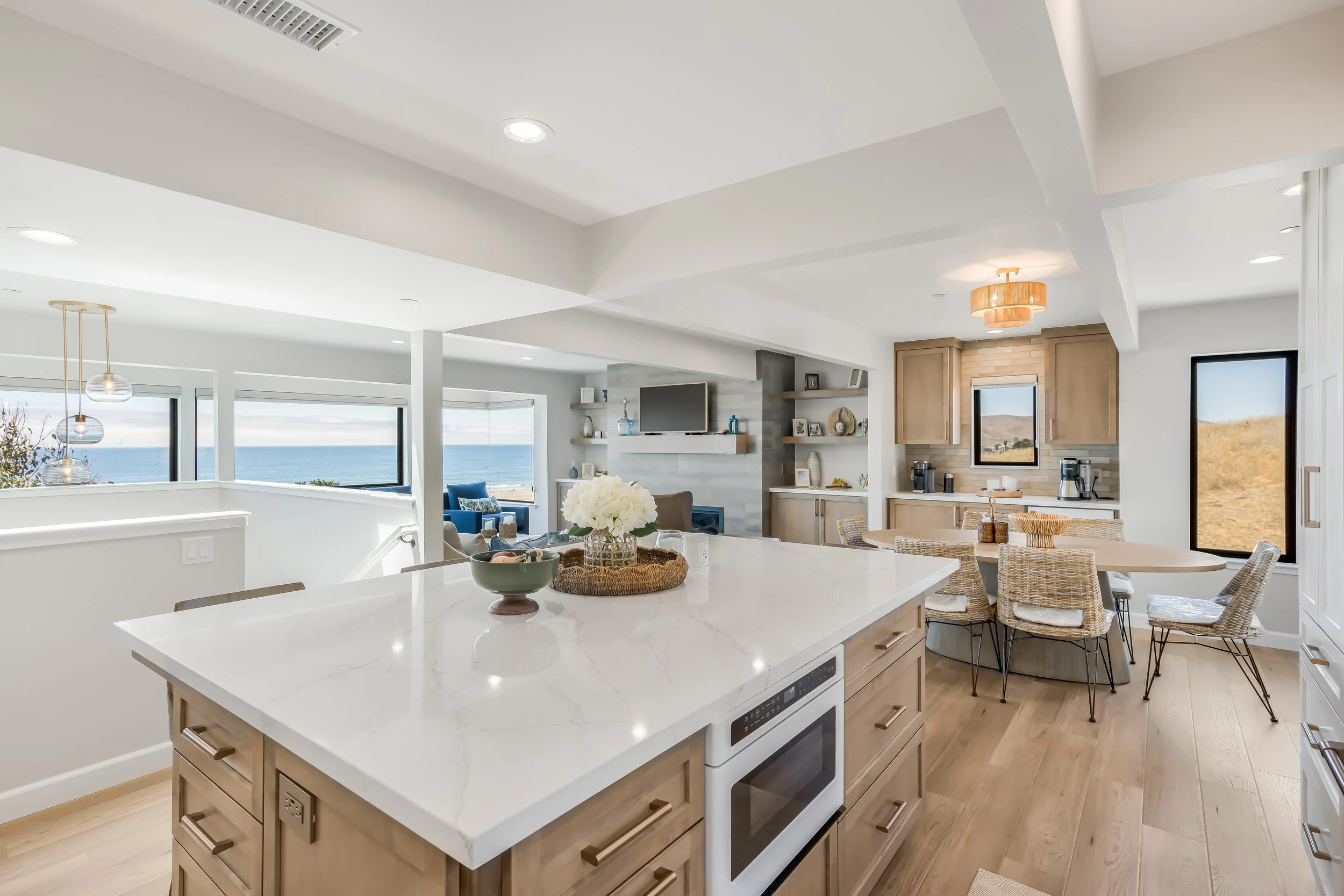Kitchen Island overlooking living room with coastal view