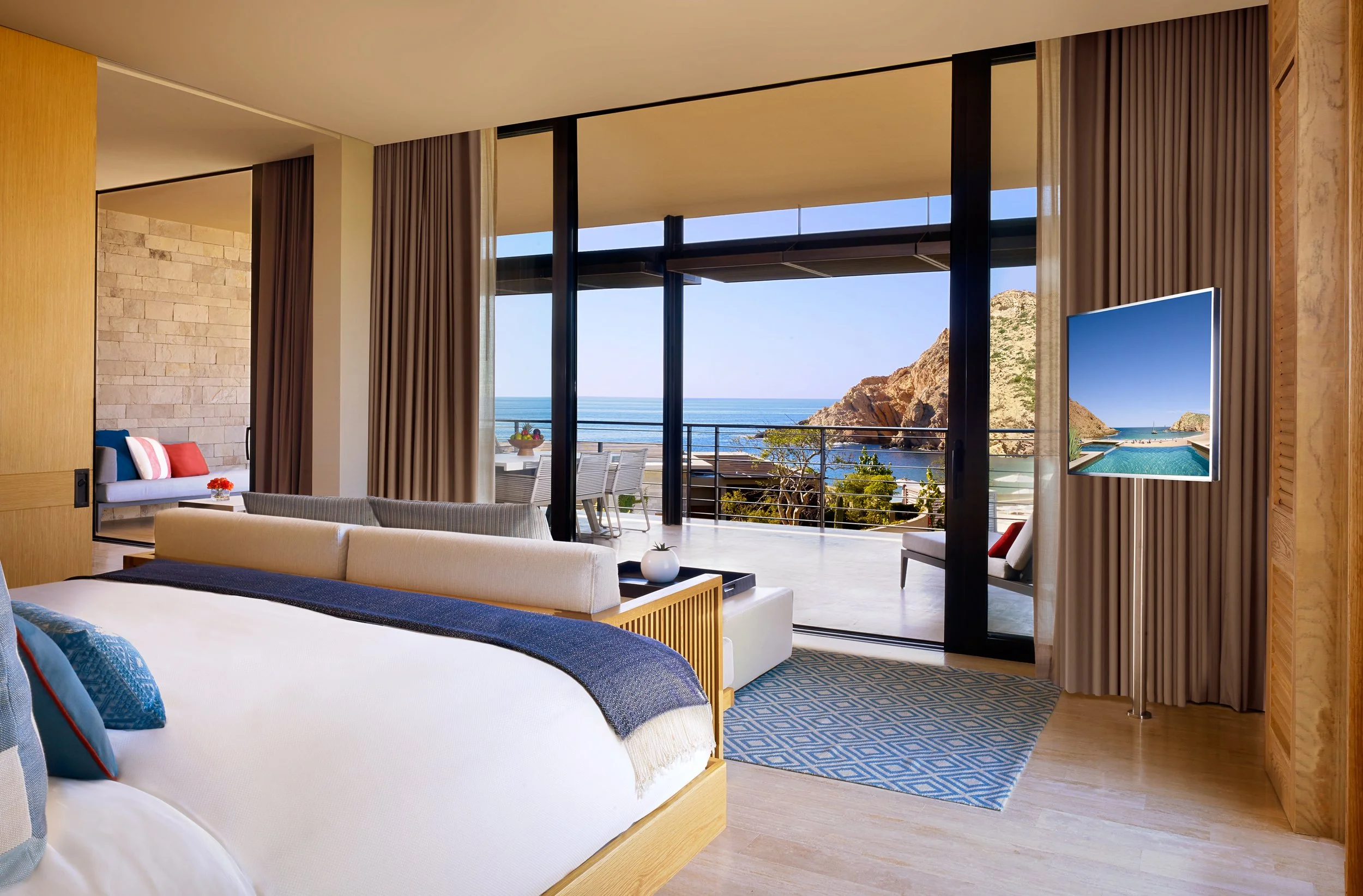 Hotel suite with an Oceanview through floor-to-ceiling doors