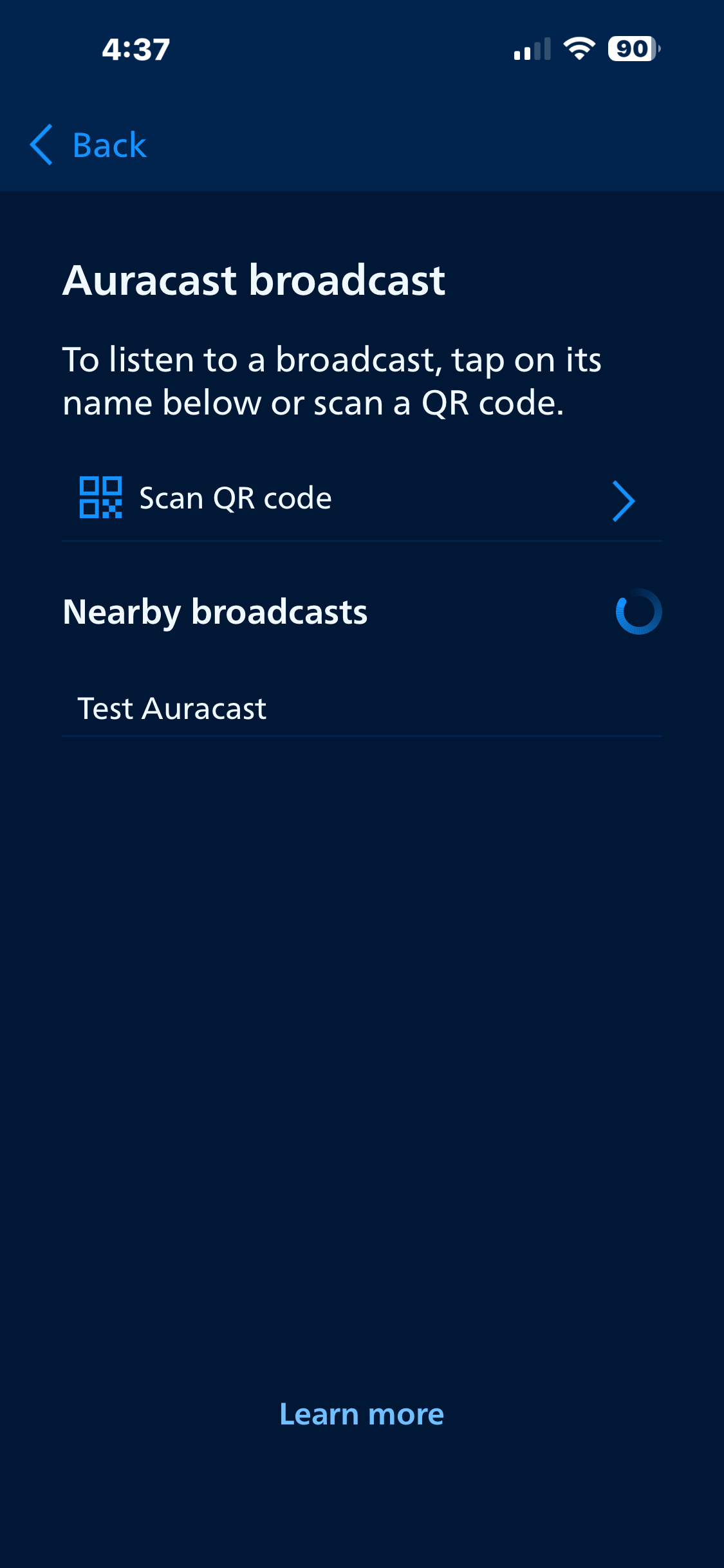 Screenshot of a mobile app screen for Auracast broadcast, showing options to scan a QR code or view nearby broadcasts, with a "Learn more" link at the bottom.