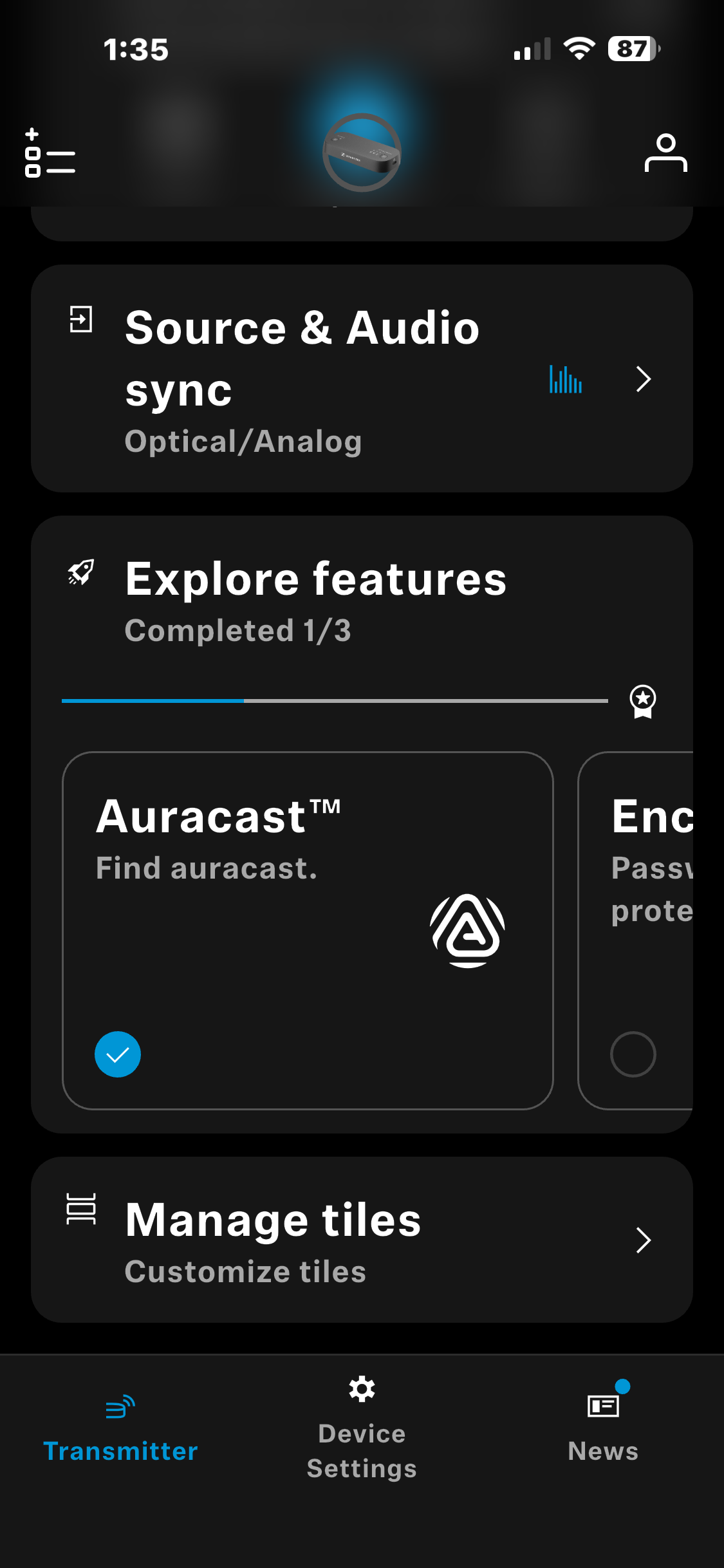 Mobile app screen showing device settings including source & audio sync, explore features, auracast, manage tiles, with transmitter, device settings, and news tabs at bottom.