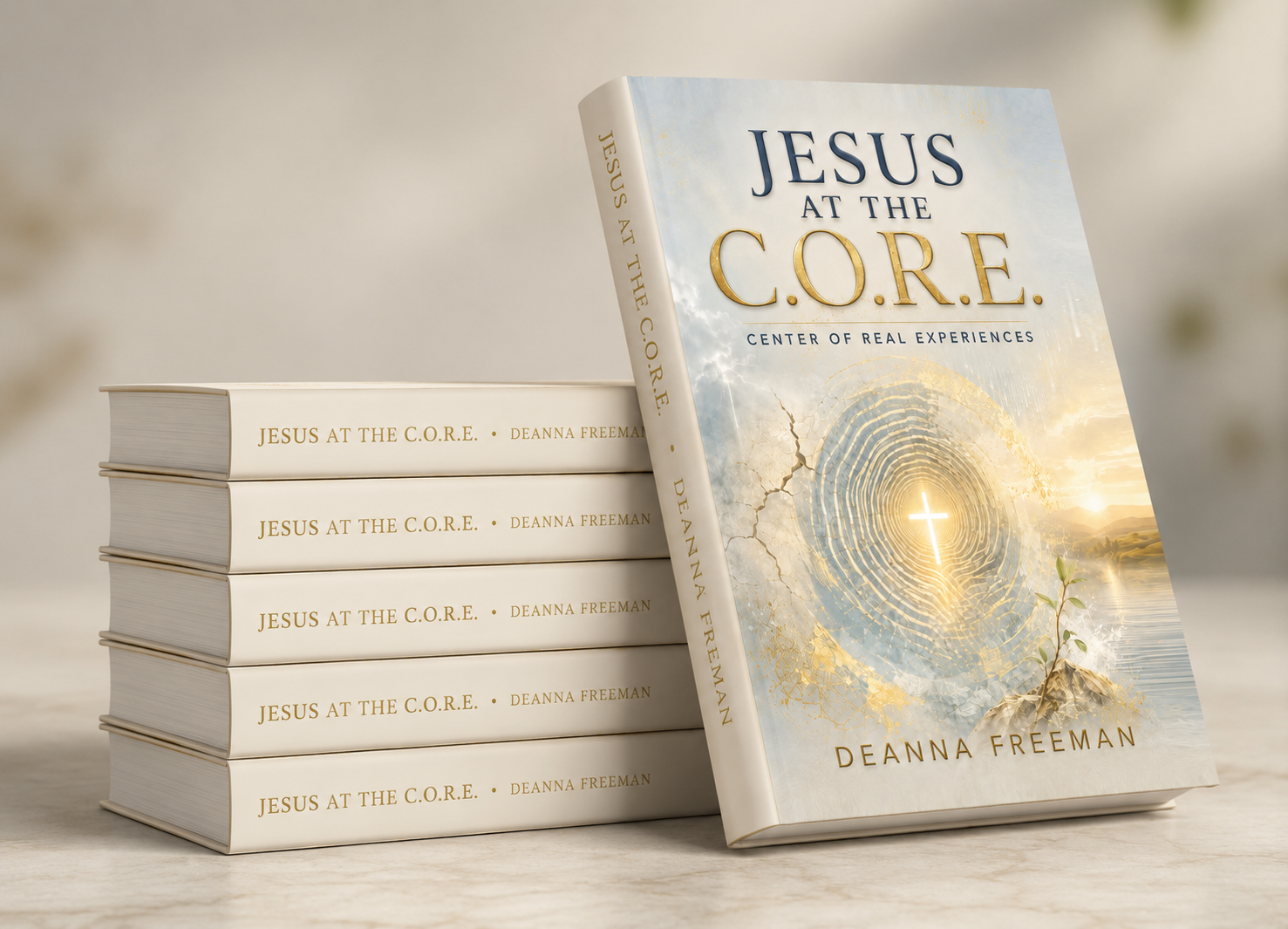 Multiple copies of a book titled "Jesus at the C.O.R.E." by Deanna Freeman, with one copy standing upright showing the cover, and the others stacked horizontally showing the side.