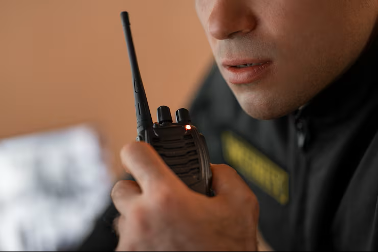 security guard holding radio.png