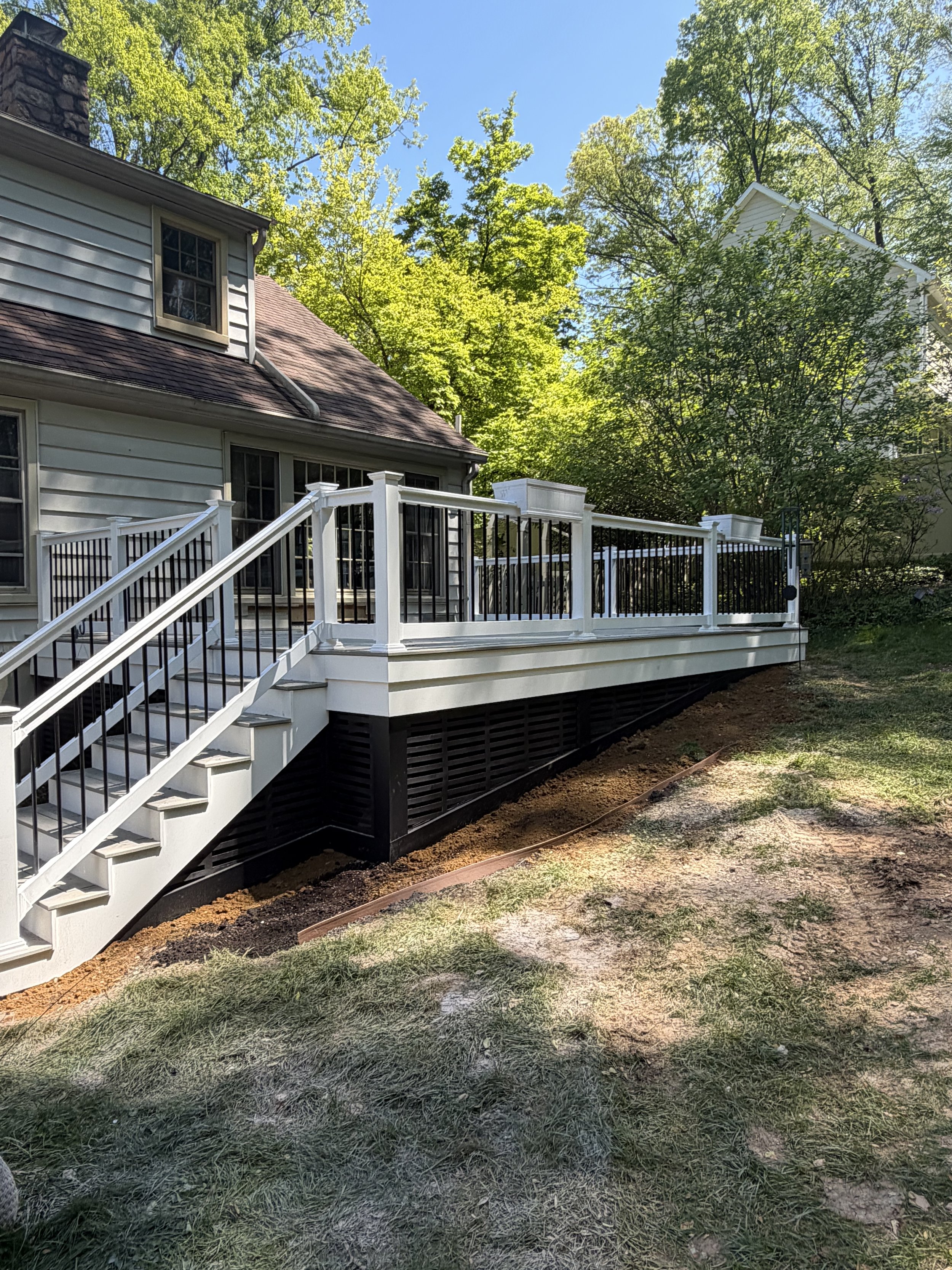 Composite deck with white PVC fascia and vinyl railing, Sussex County DE